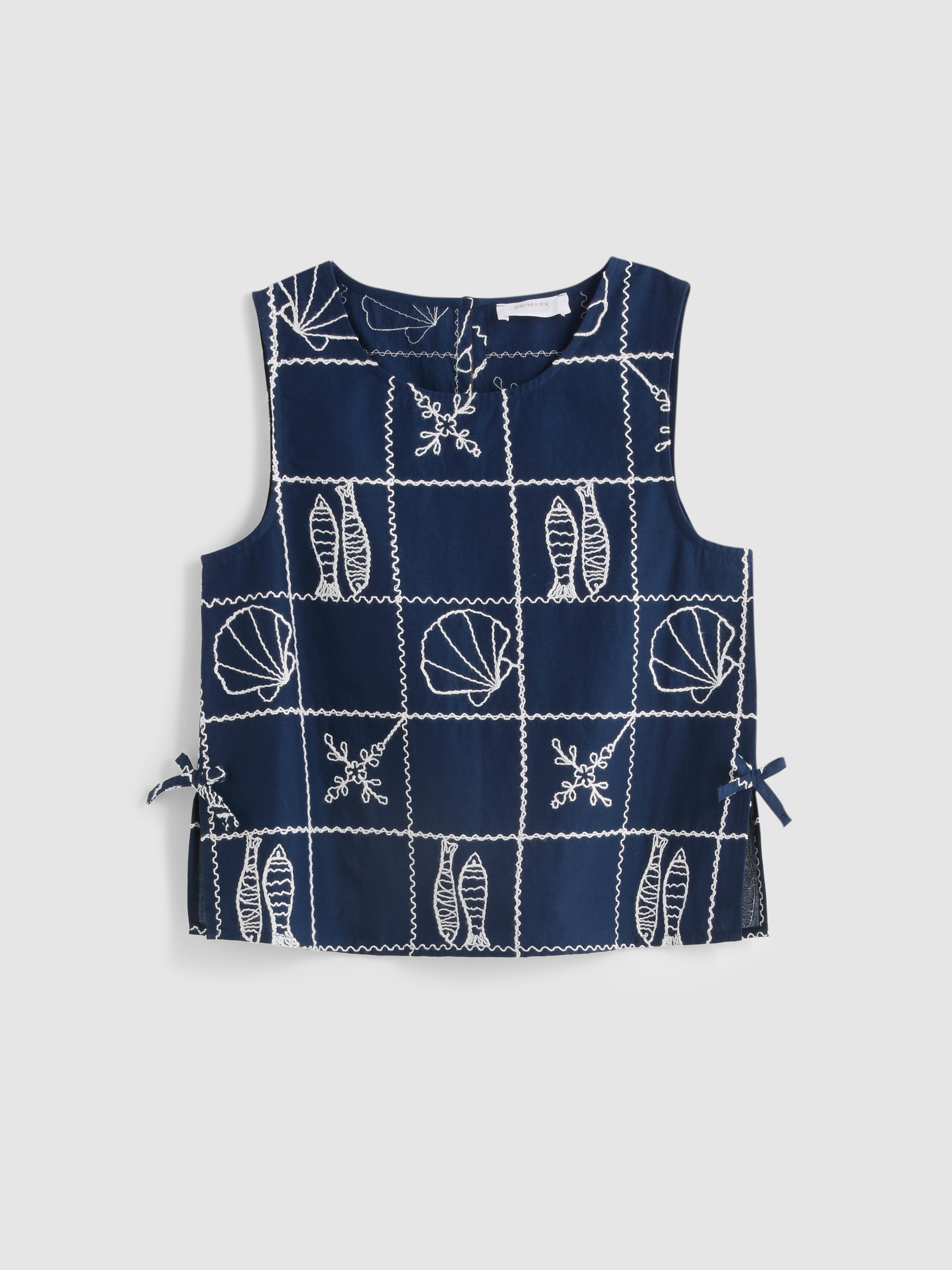 7-15 jr | Mouwloze blouse met borduursel