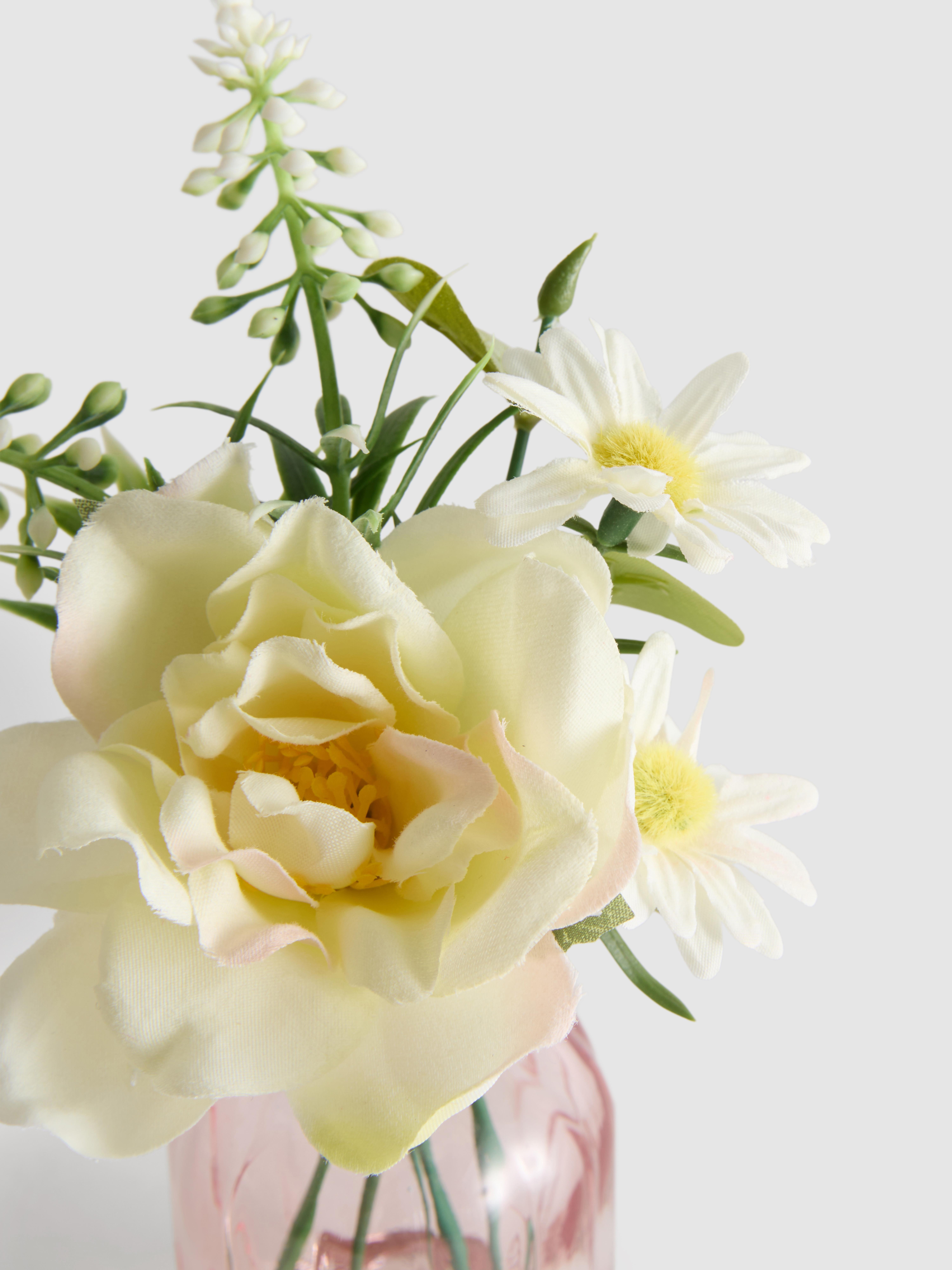 Composizione di fiori artificiali in vaso a bottiglia