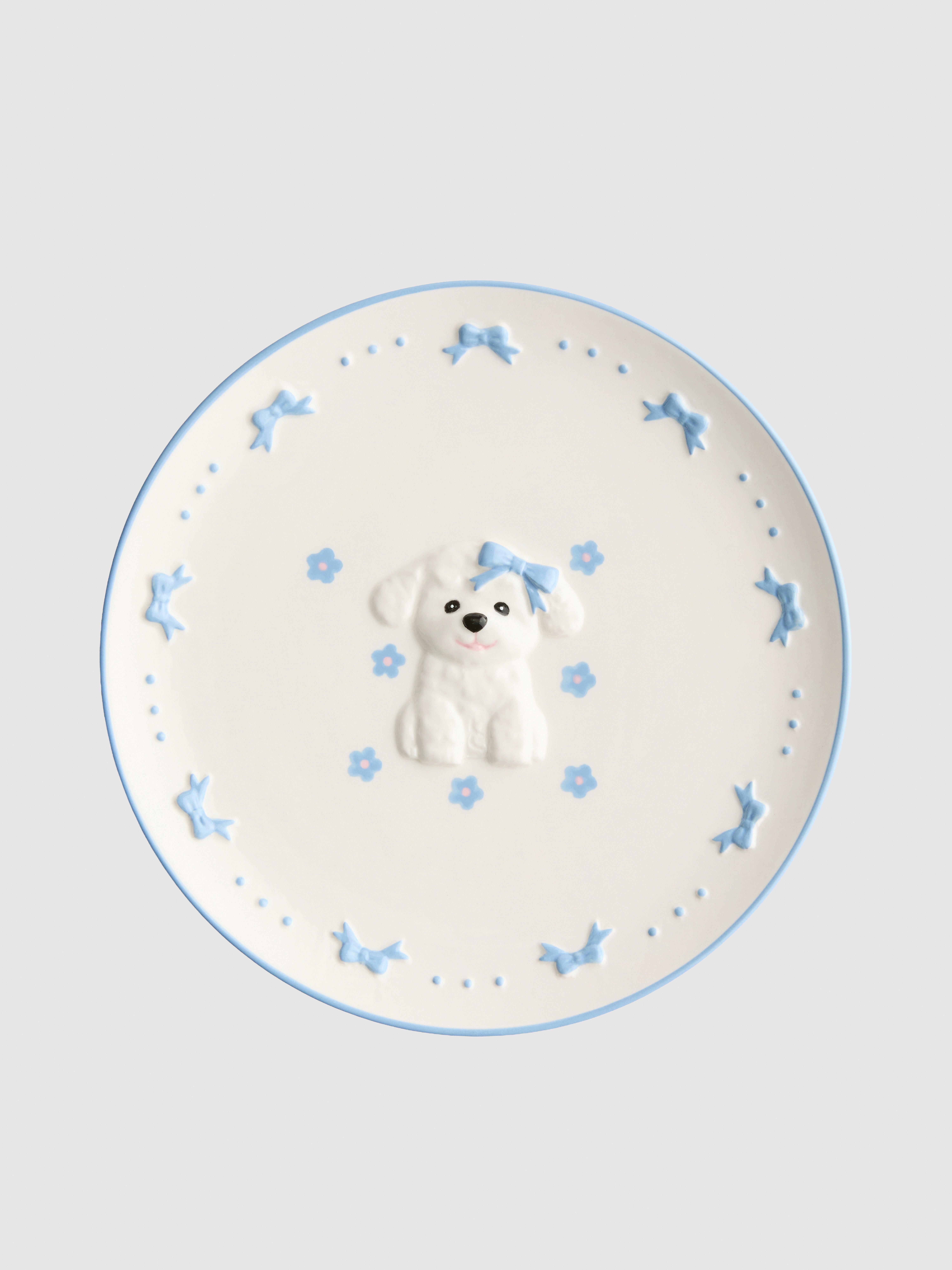 Plato de postre con bichón maltés