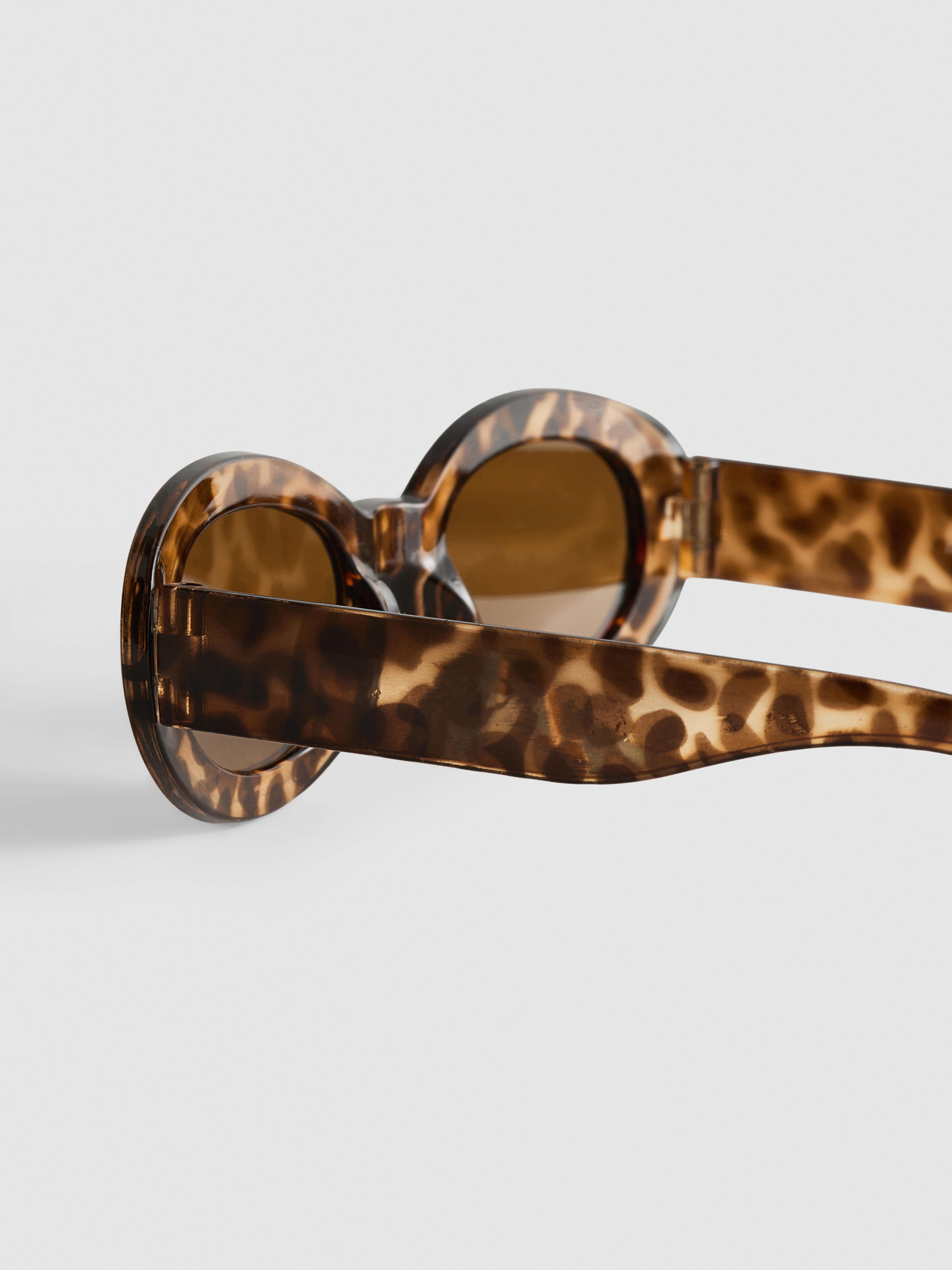Occhiali da sole ovali con fantasia animalier