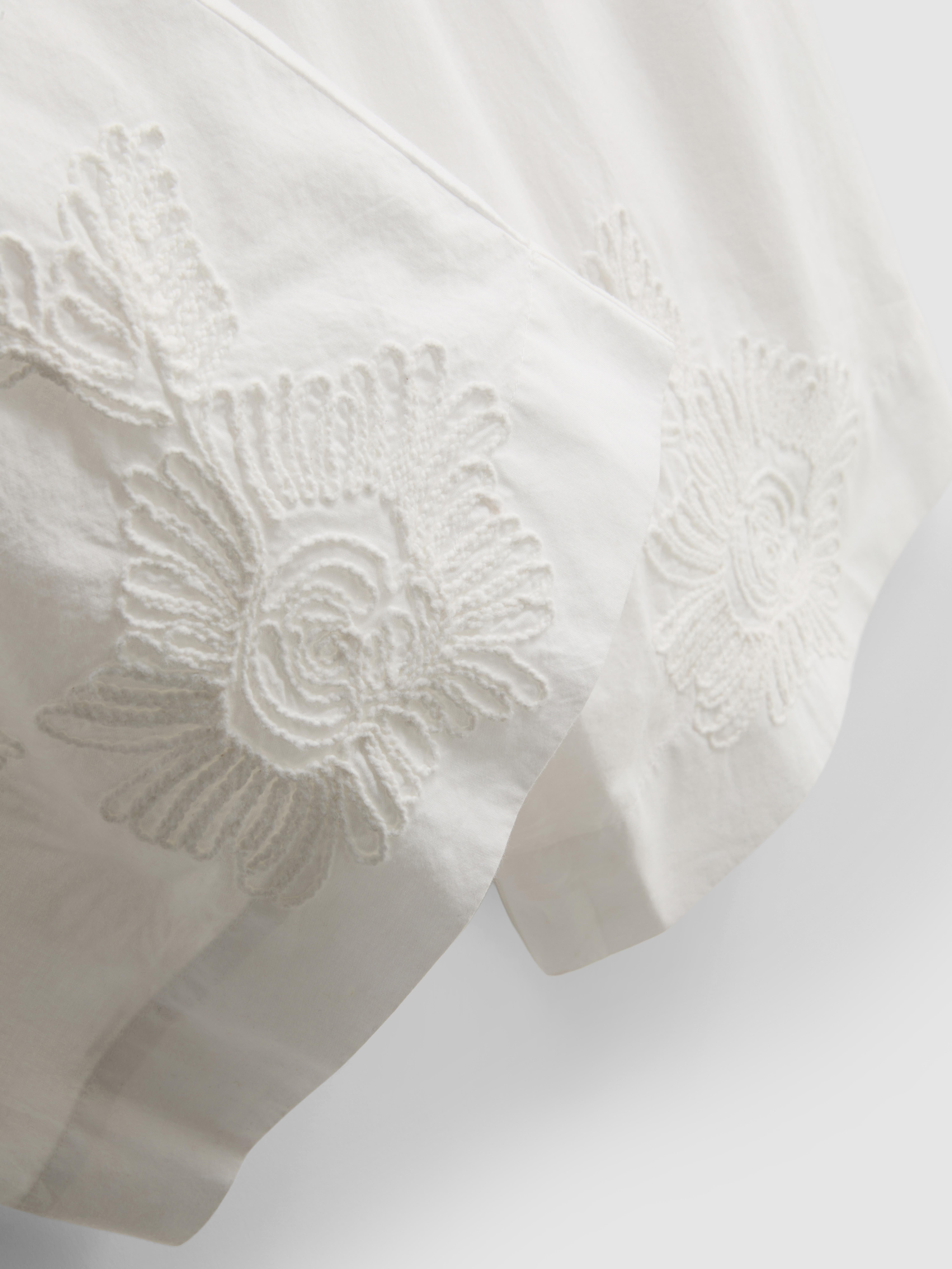 Pantalones de pernera ancha bordados de algodón