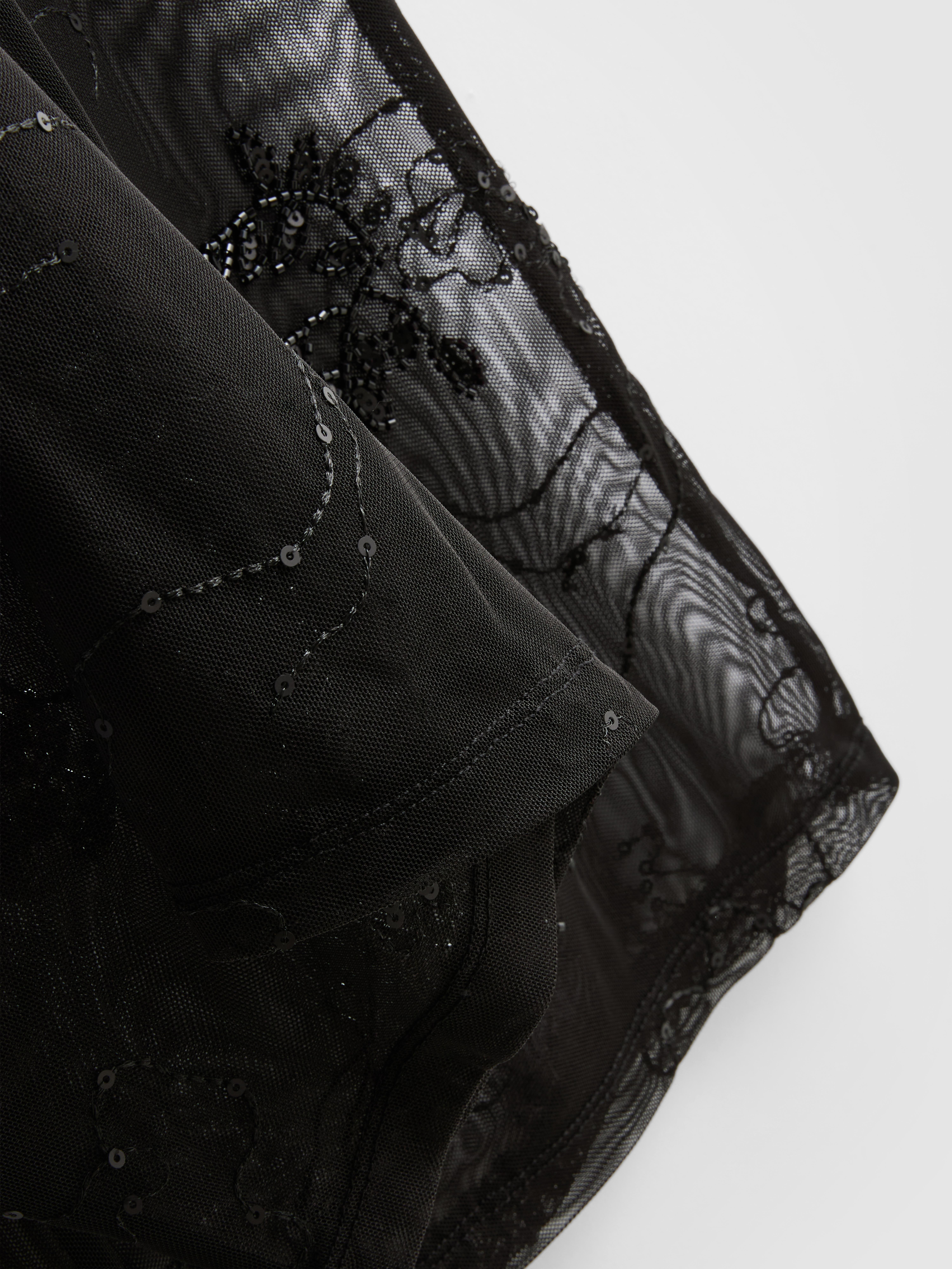 Mesh broek met wijde pijpen Paula Echevarría