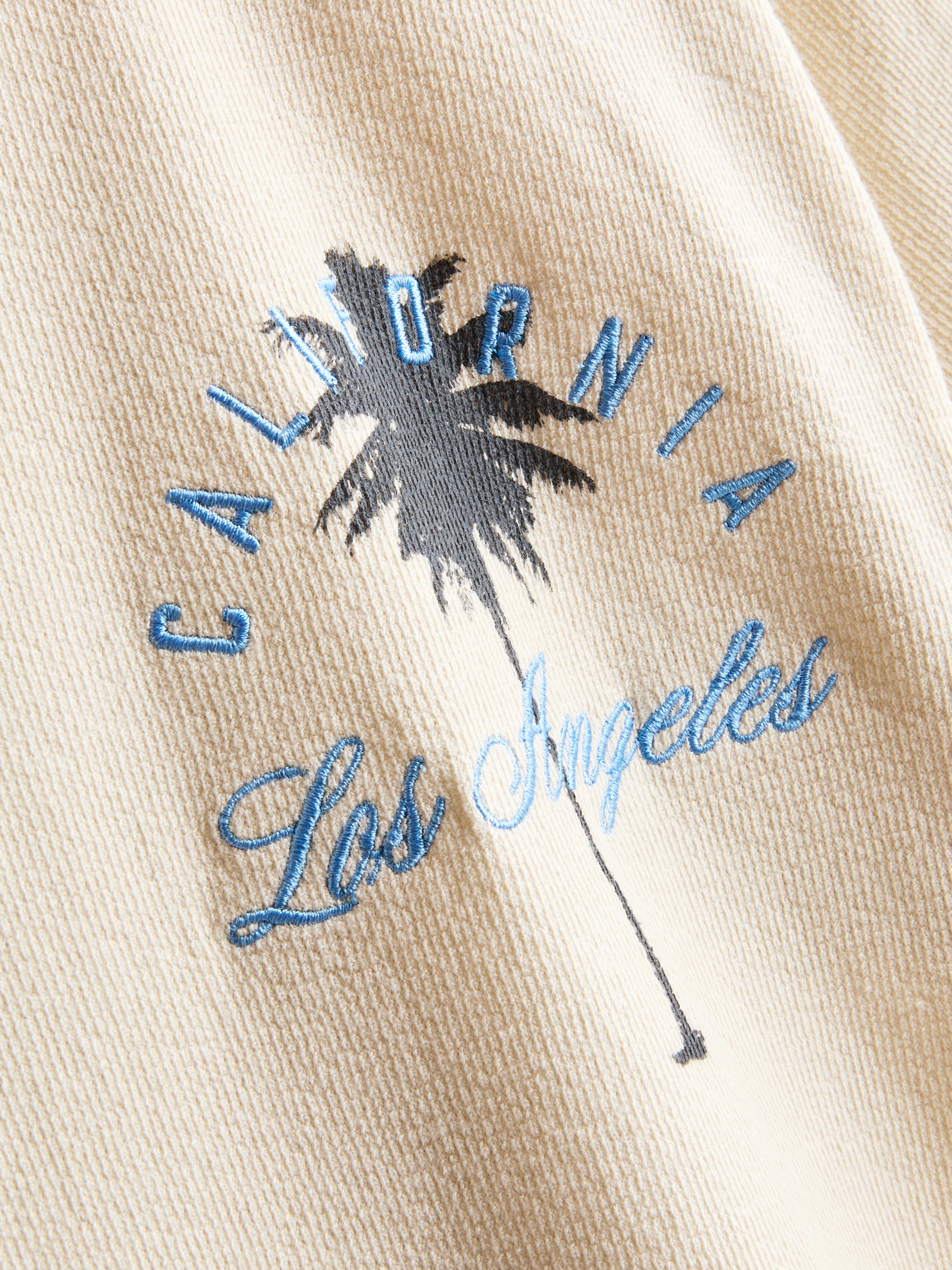 7-15 años | Camiseta texturizada con palmeras