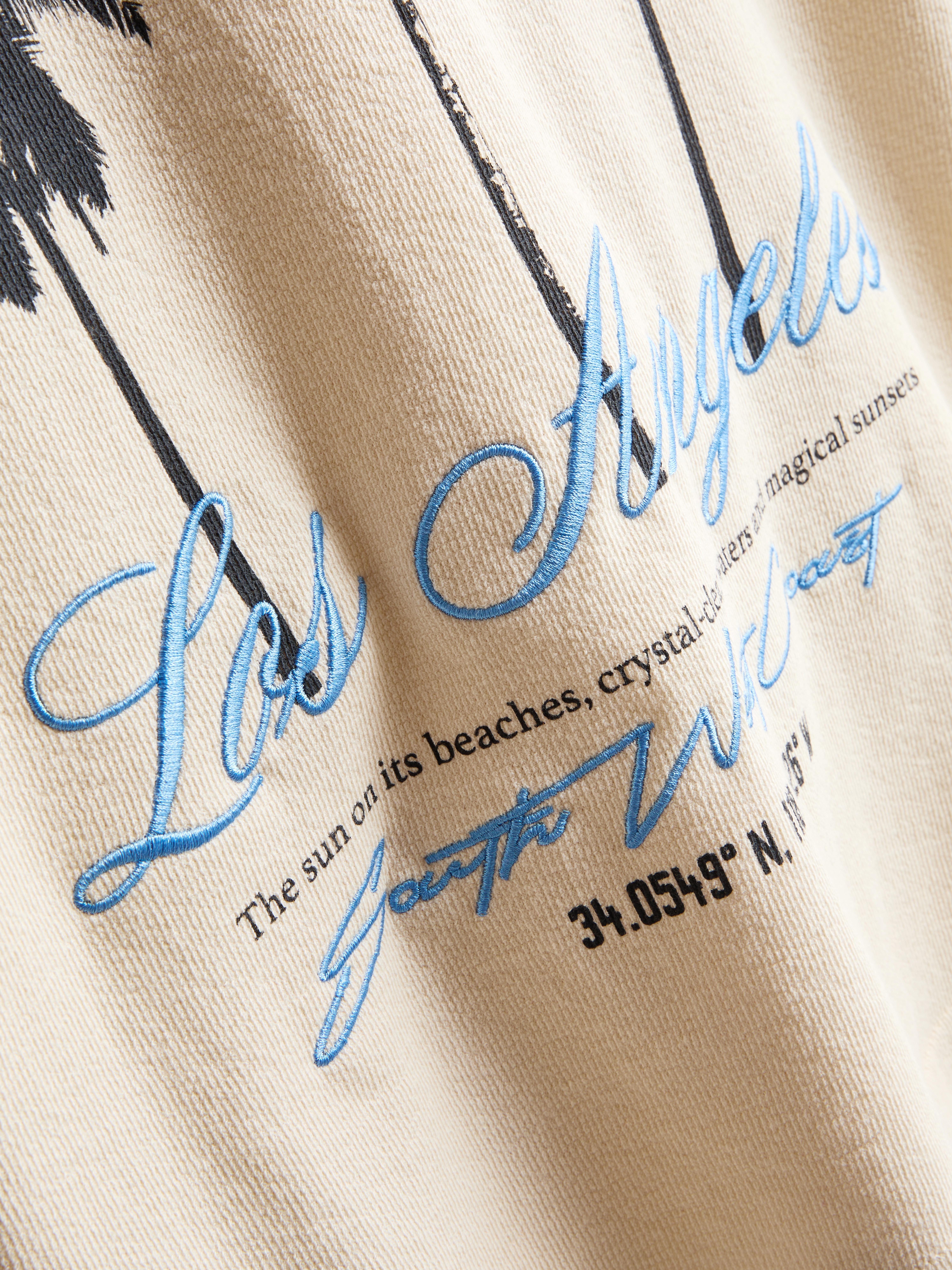 7-15 años | Camiseta texturizada con palmeras