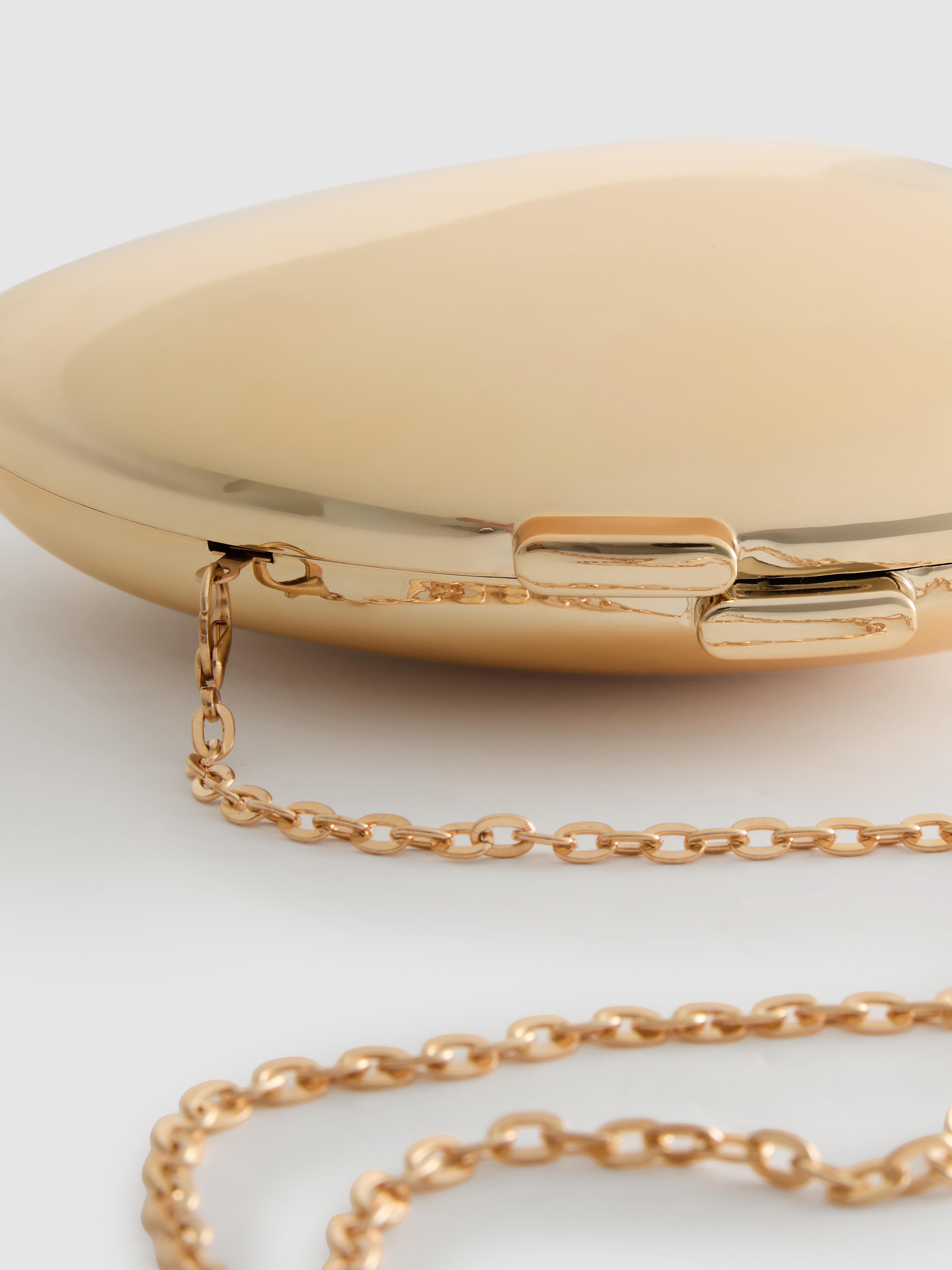 Ovale „Paula Echevarría“ Umhängetasche in Metallic-Optik