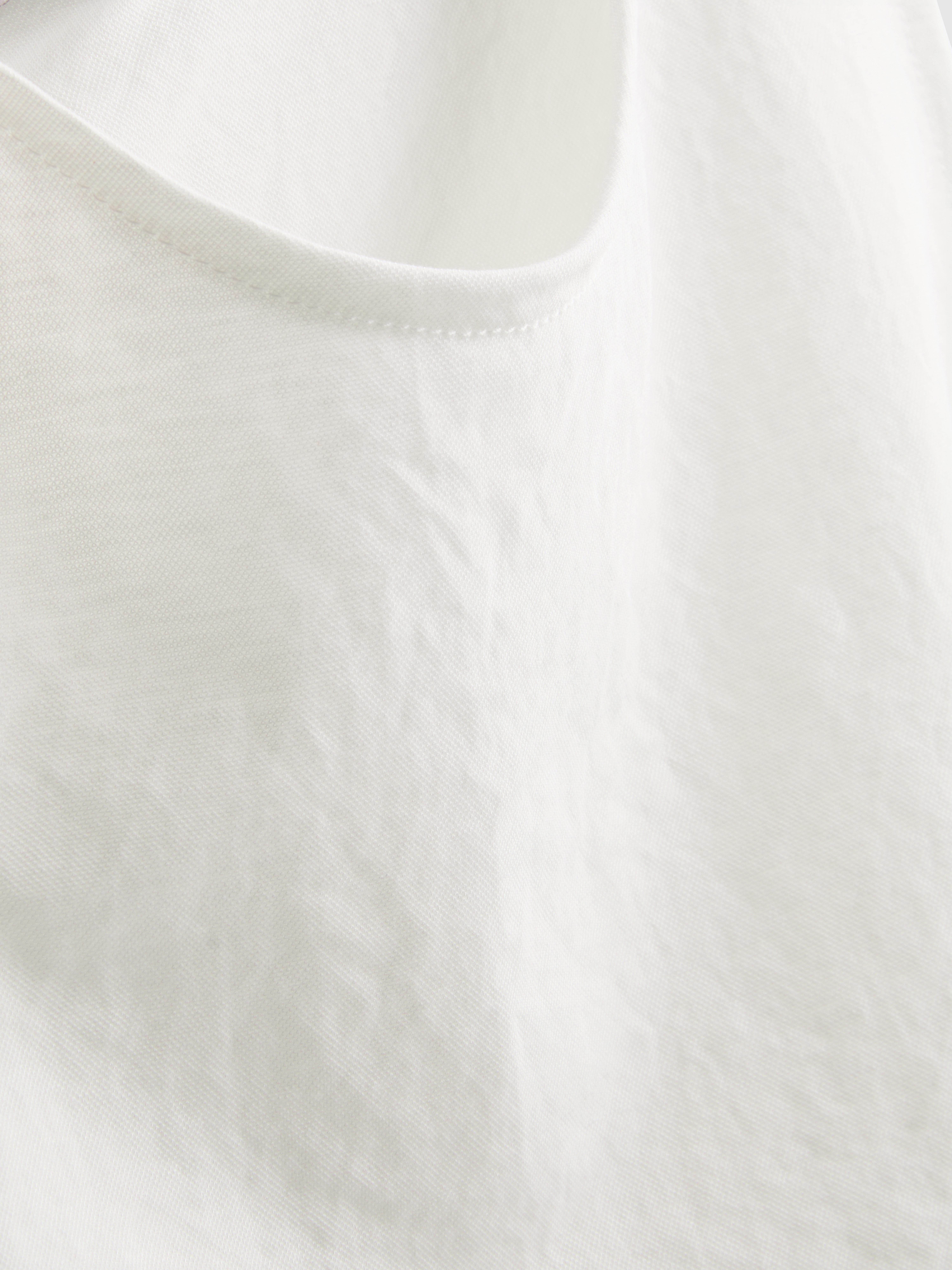 Camiseta sin mangas texturizada con lazo lateral