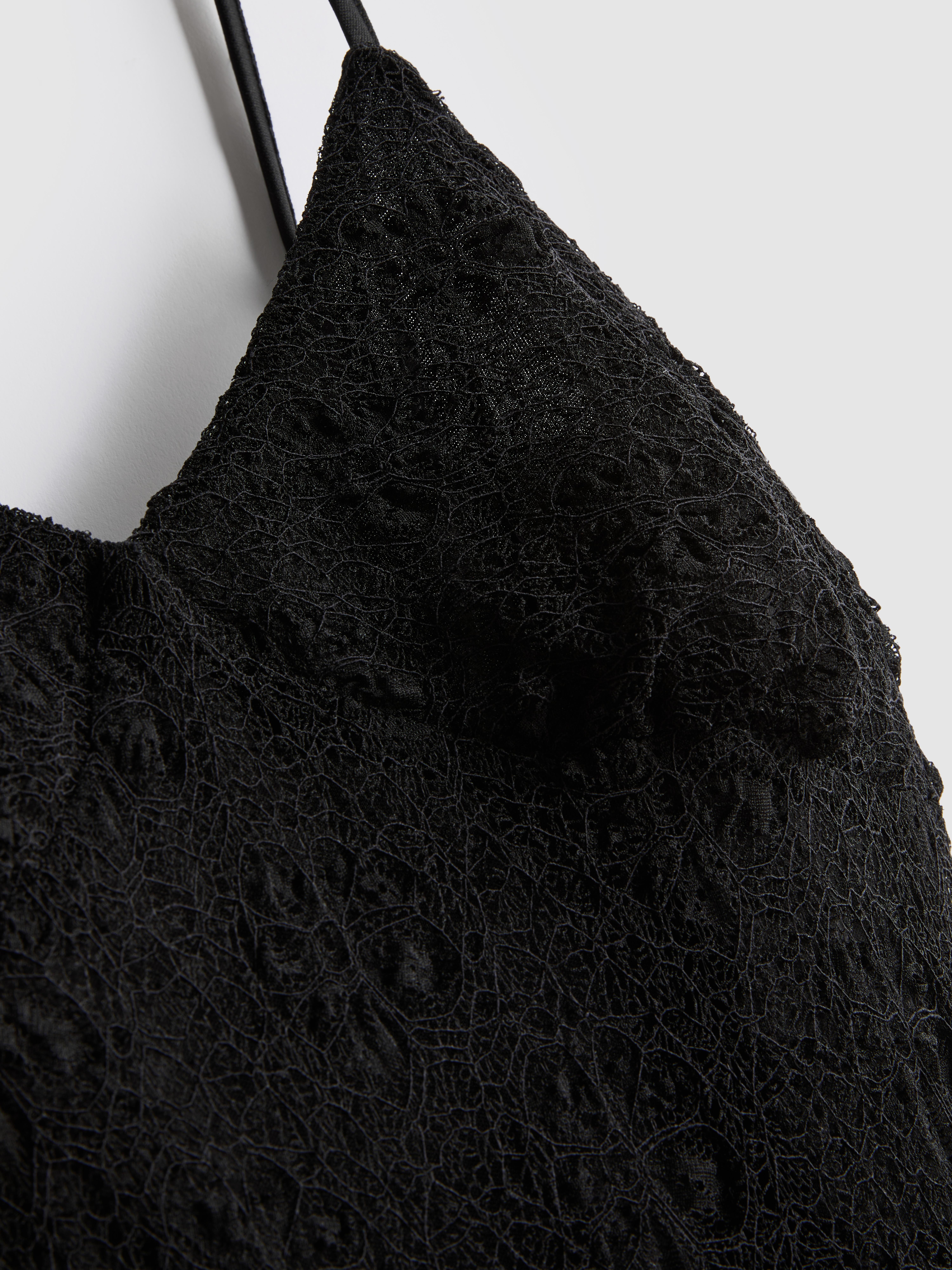black high neck bodycon mini dress Shop Women's Black Ribbed Bodycon Mini Dress with Fringe Hem| Showoffff main image 0
