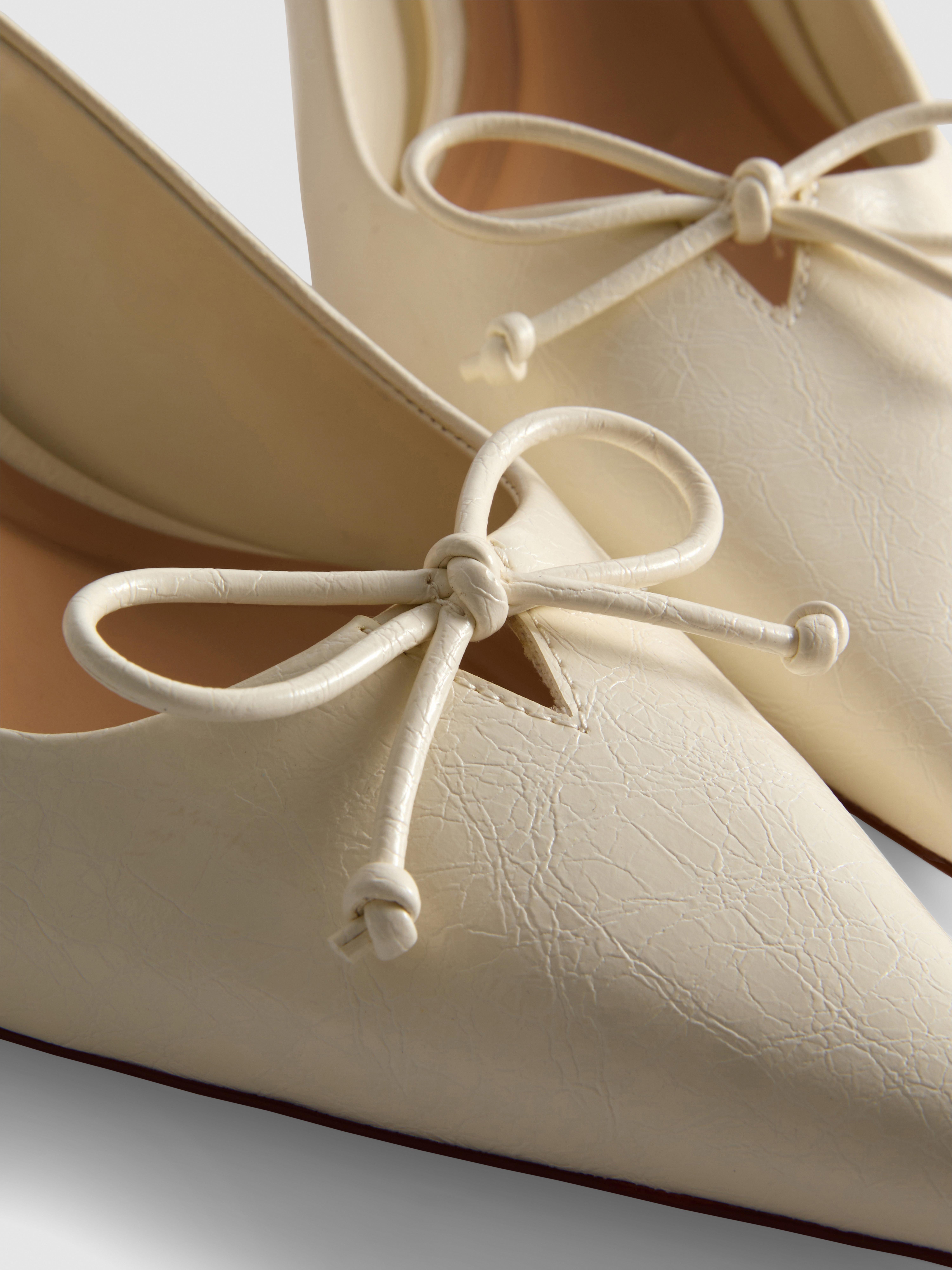 Slingback-Pumps mit Zierschleife