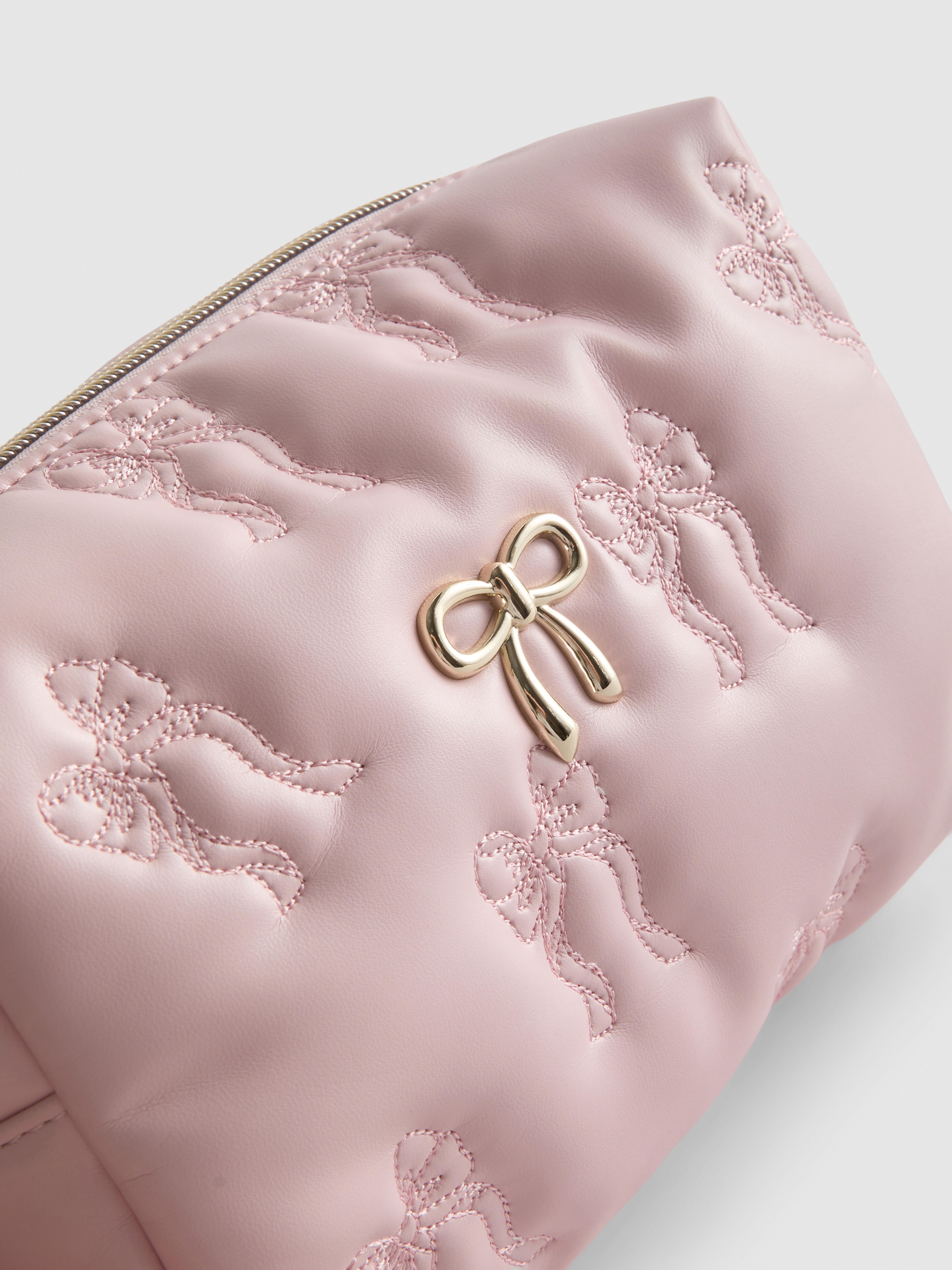Bolsa de maquillaje acolchada con lazos