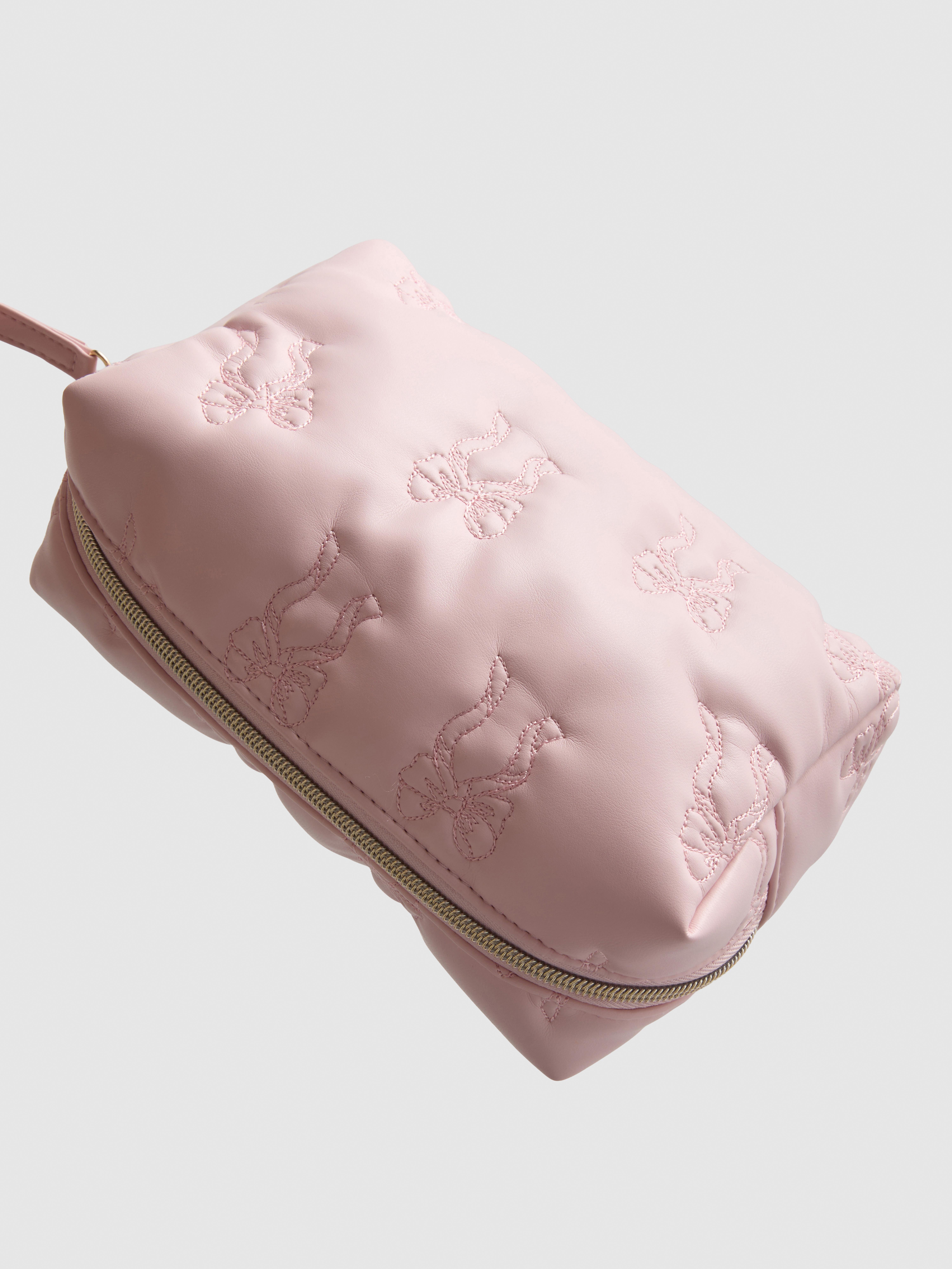 Bolsa de maquillaje acolchada con lazos
