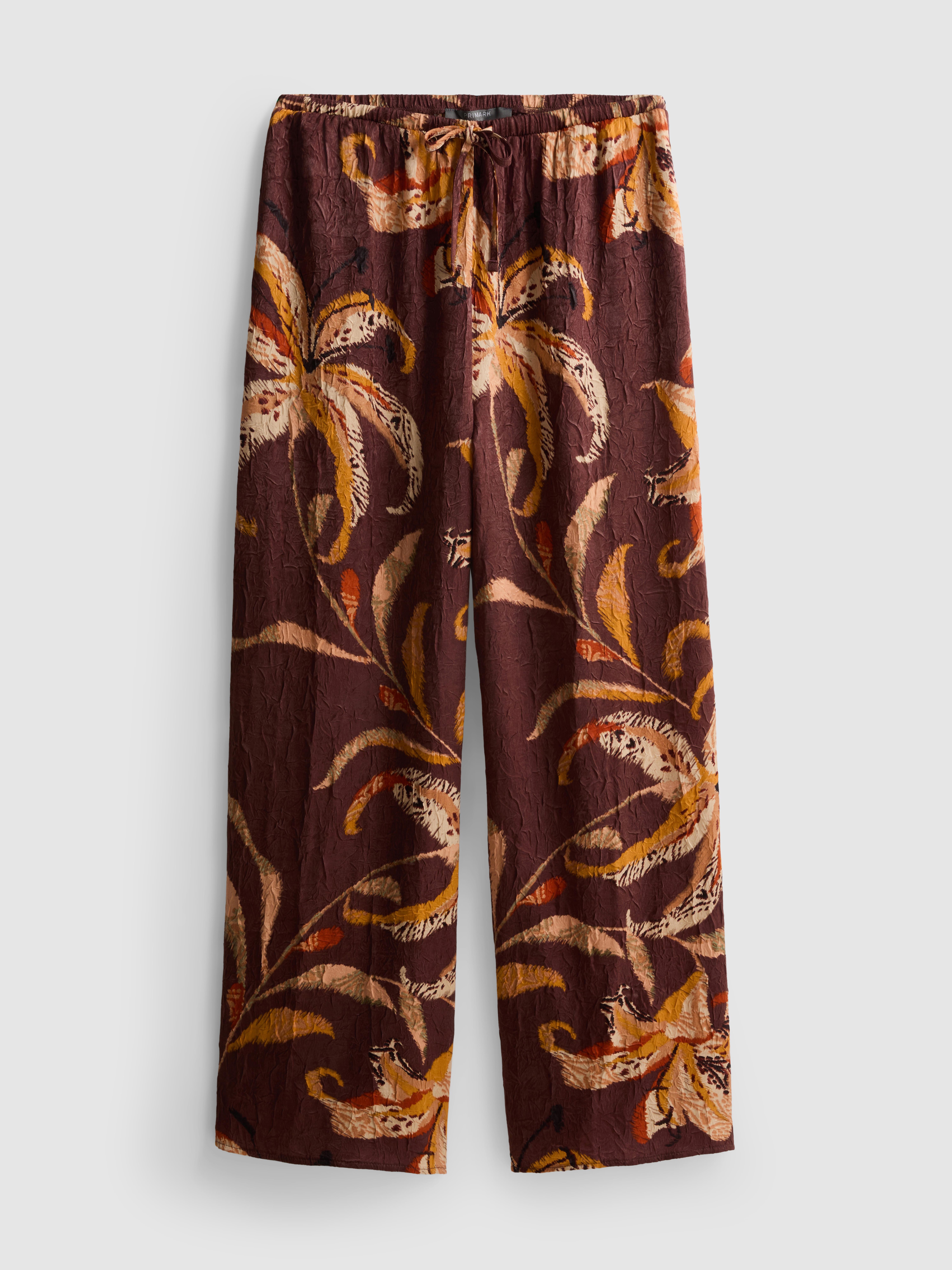 Pantalon large en satin froissé à motif floral