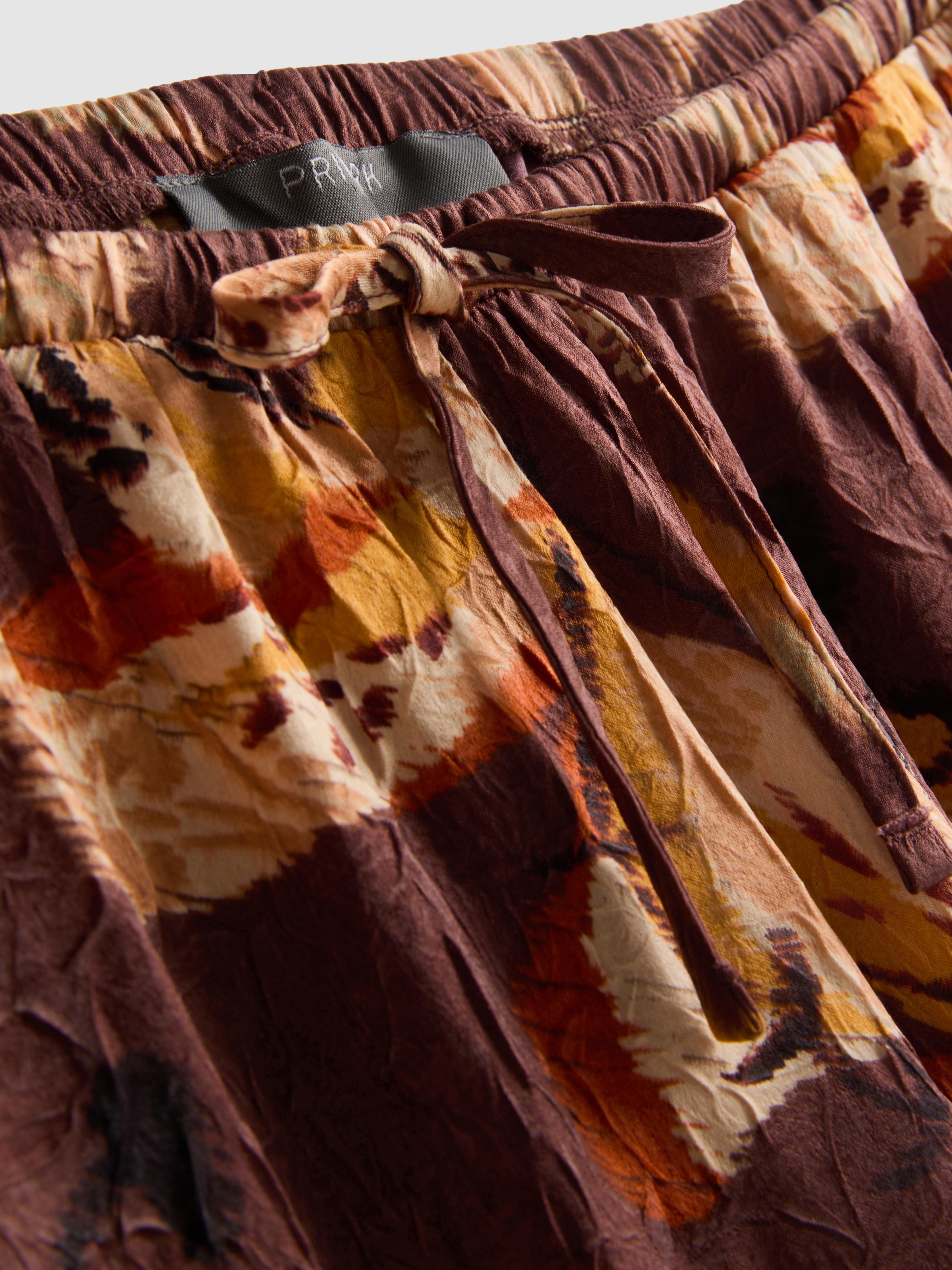 Pantalon large en satin froissé à motif floral