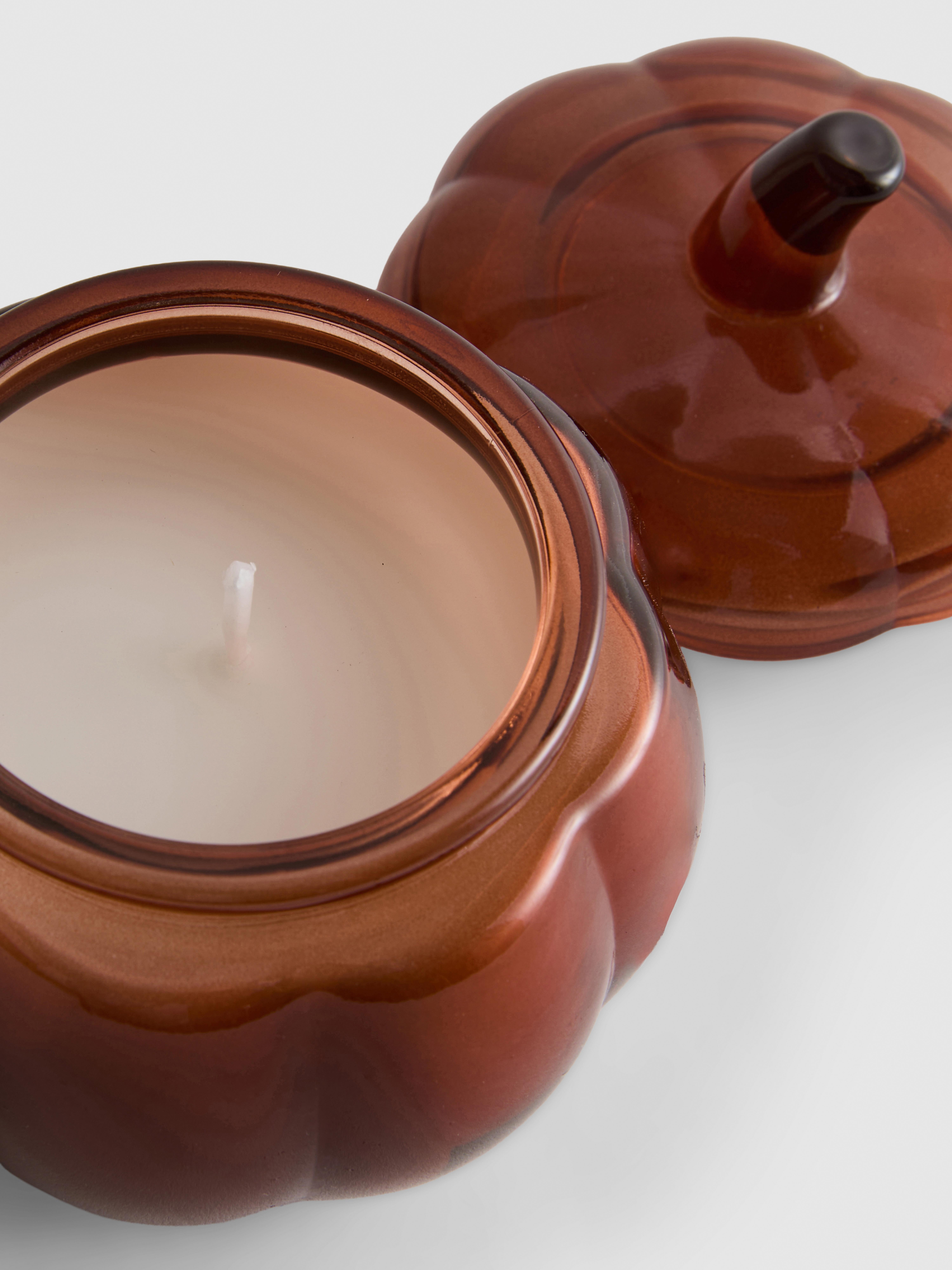 Vela en recipiente en forma de calabaza con tapa