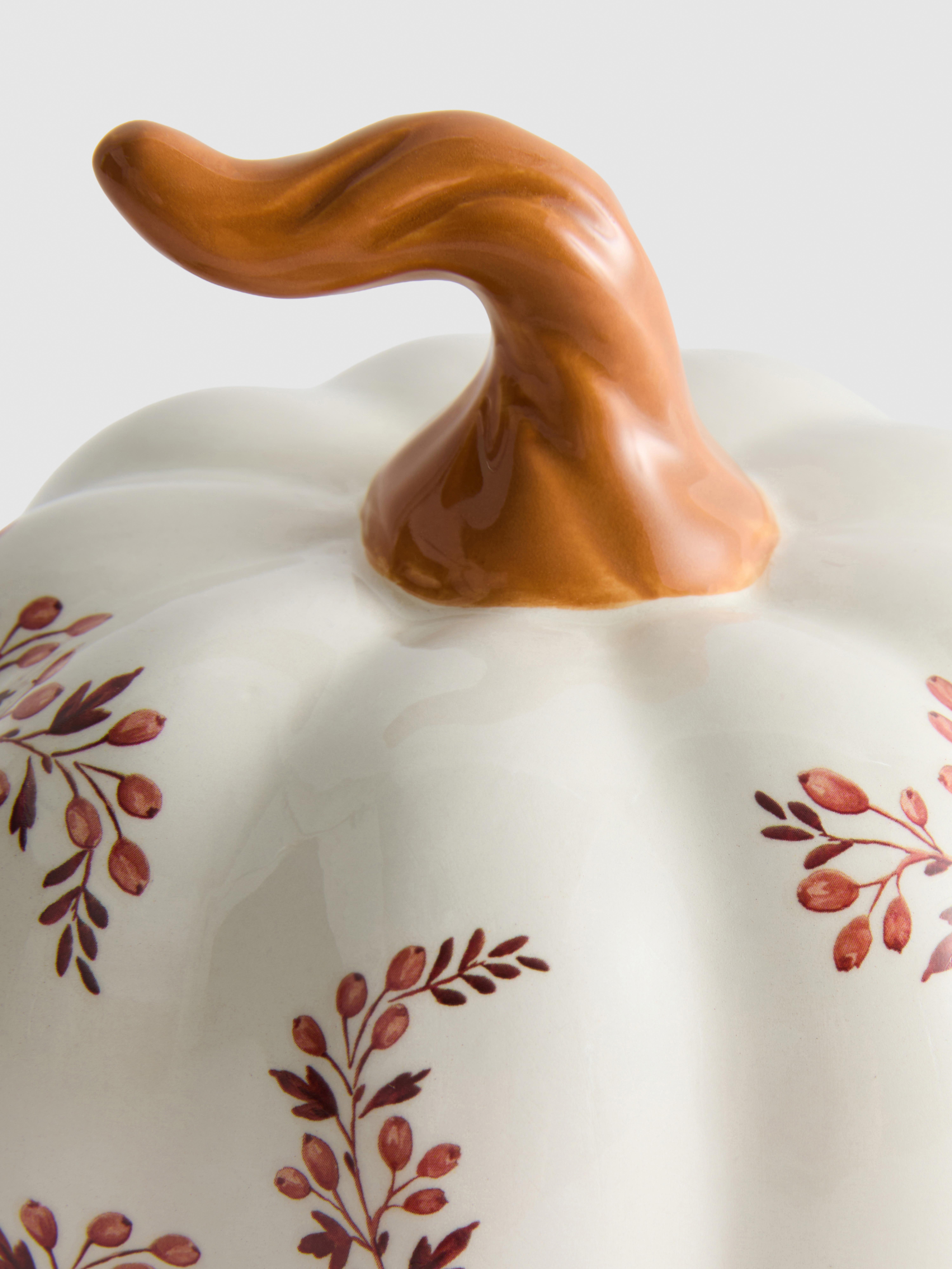 Keramieken pompoendecoratie met bloemmotief