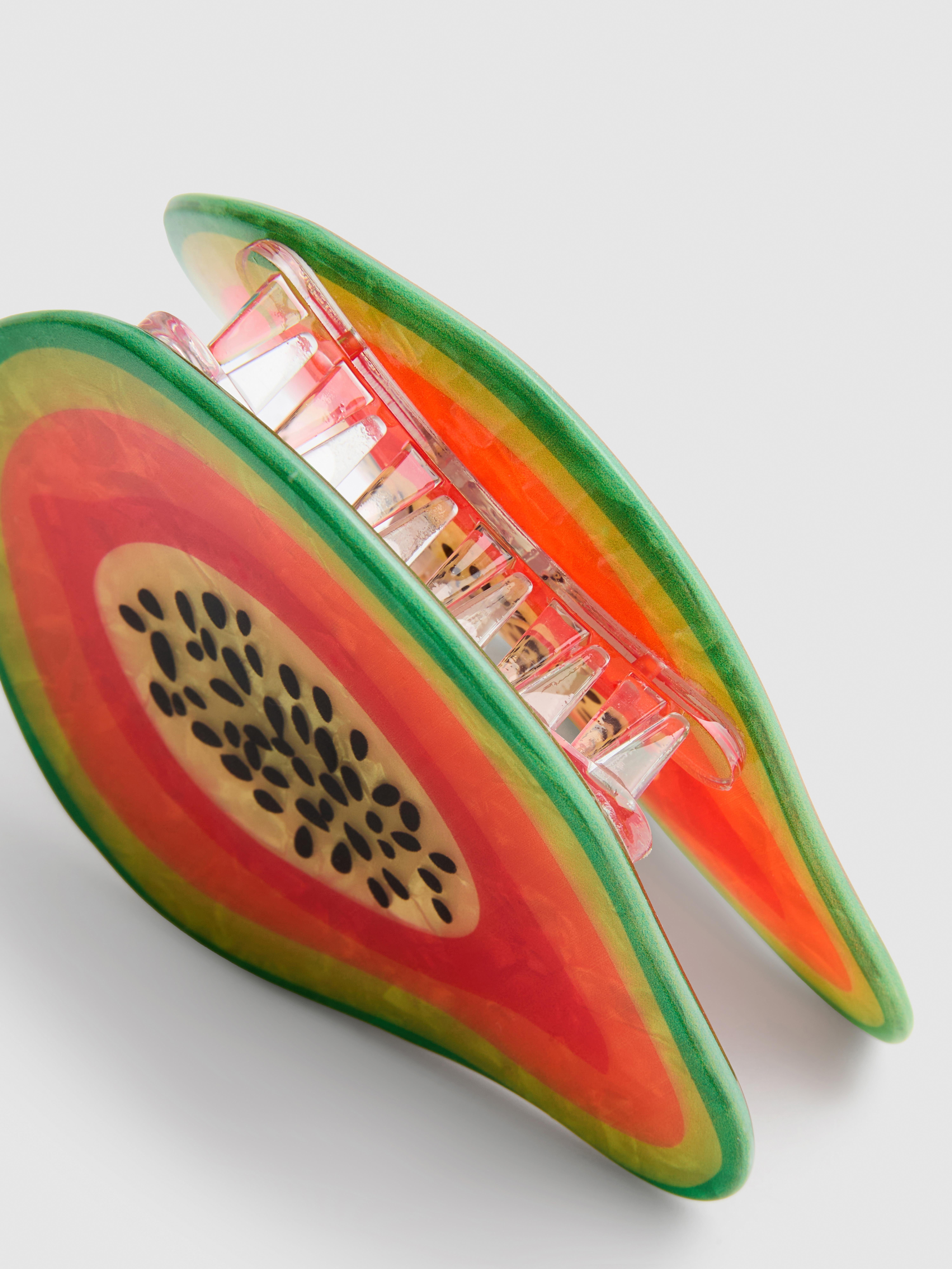 Fermacapelli a forma di papaya