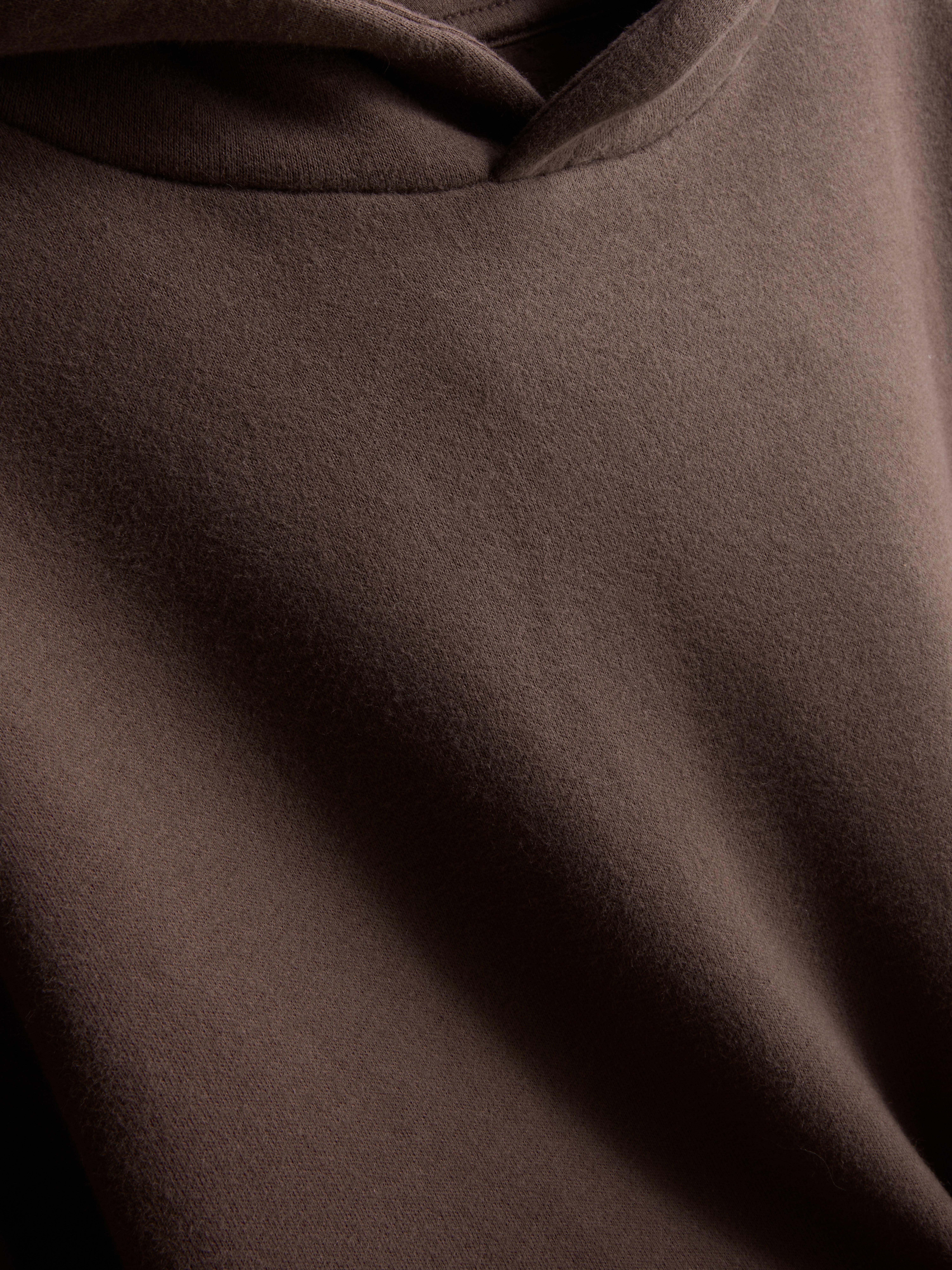 7–15 ans | Sweat à capuche en coton majoritaire