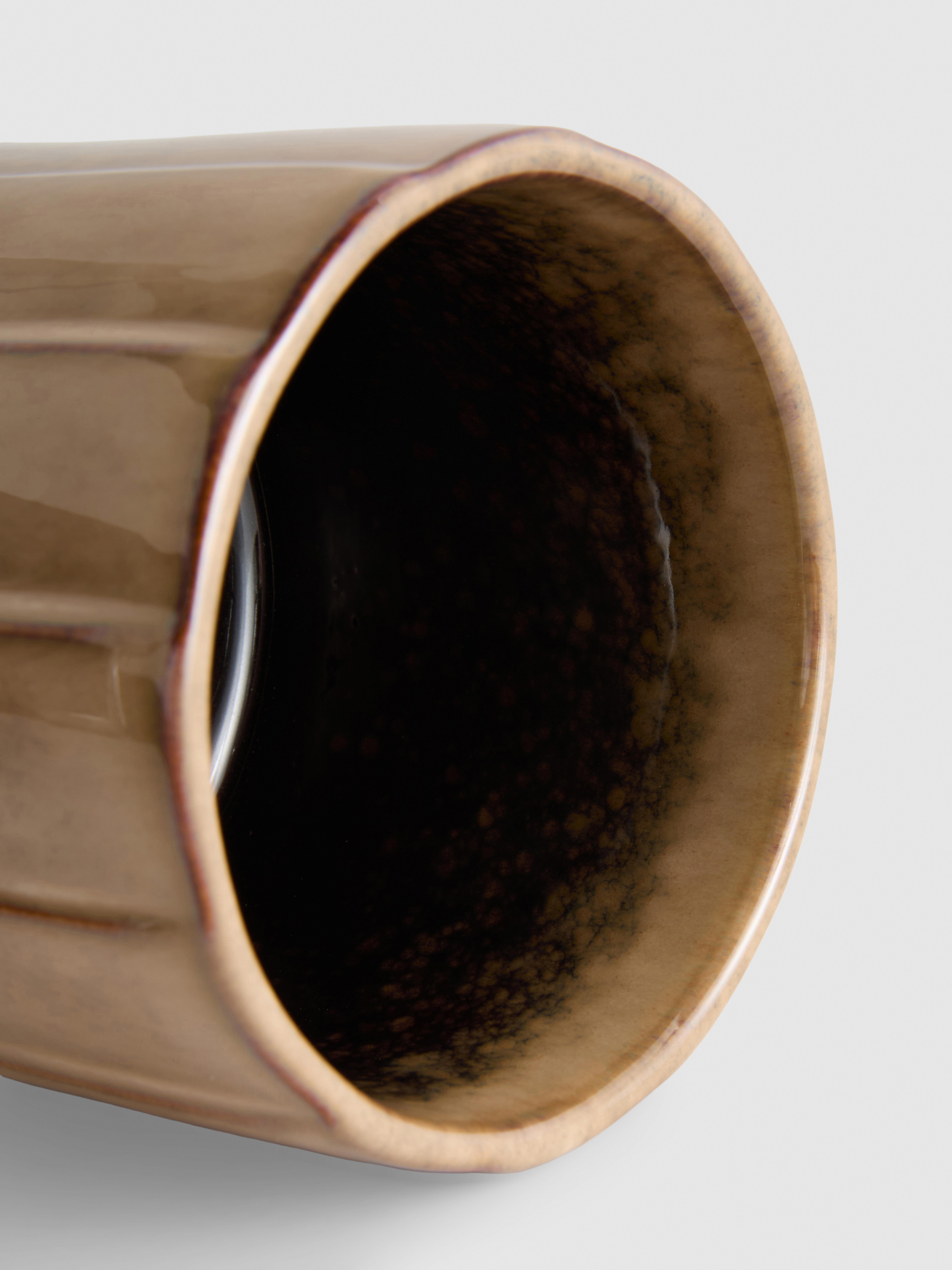 Vaso per pianta con smalto reattivo