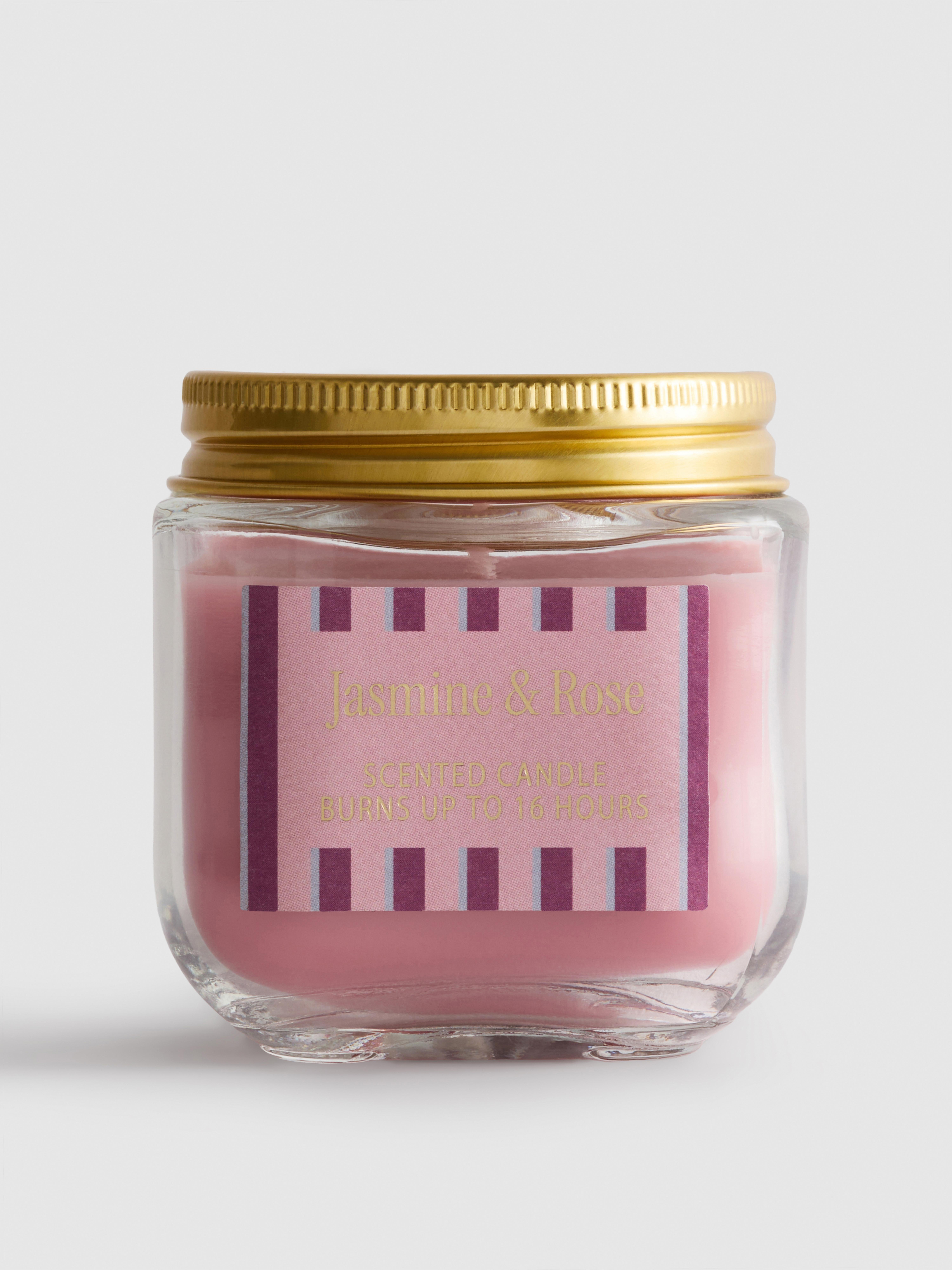 Bougie parfumée dans un pot à couvercle Rose vif
