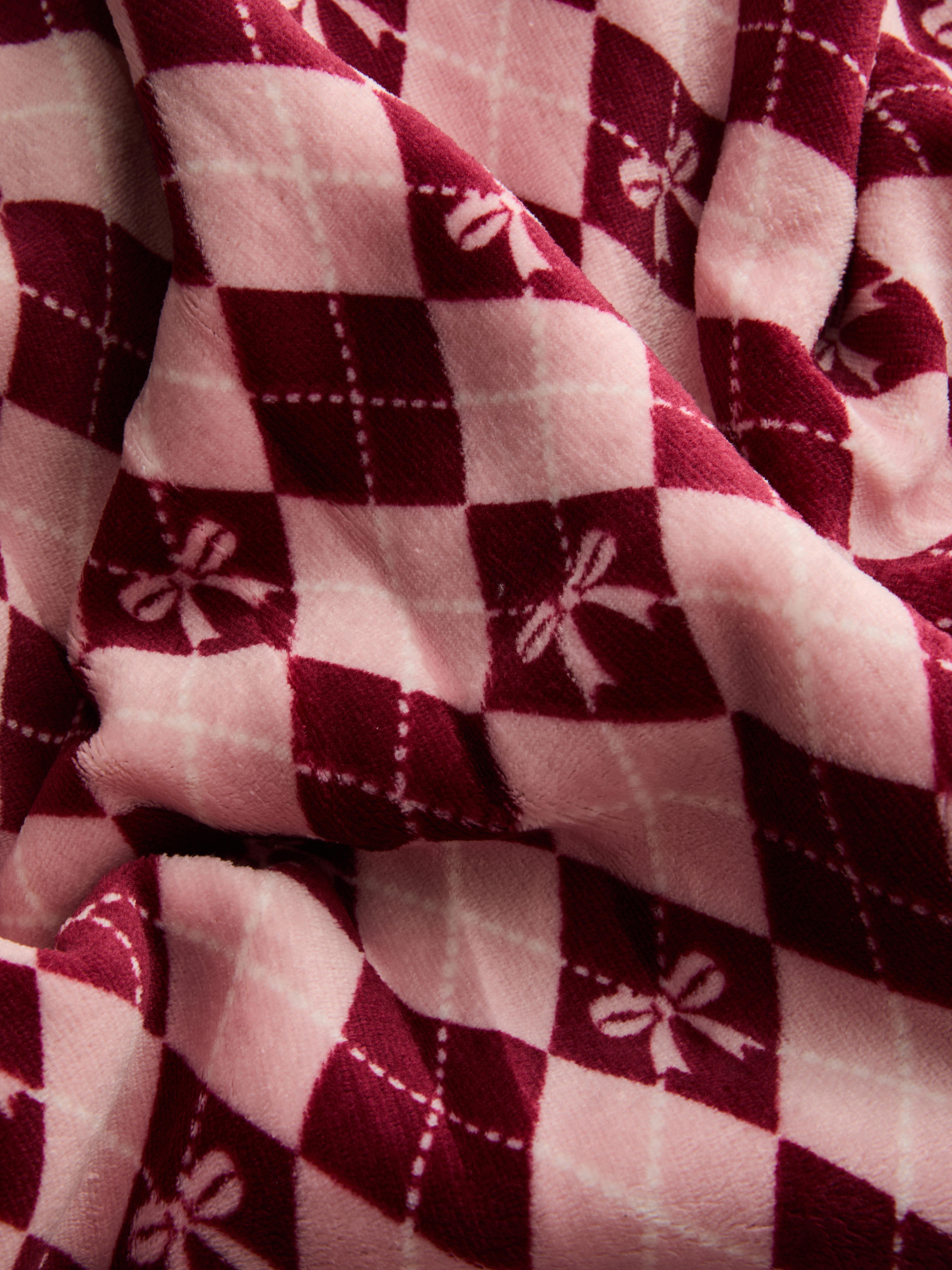 Manta con lazos y estampado a rombos Argyle