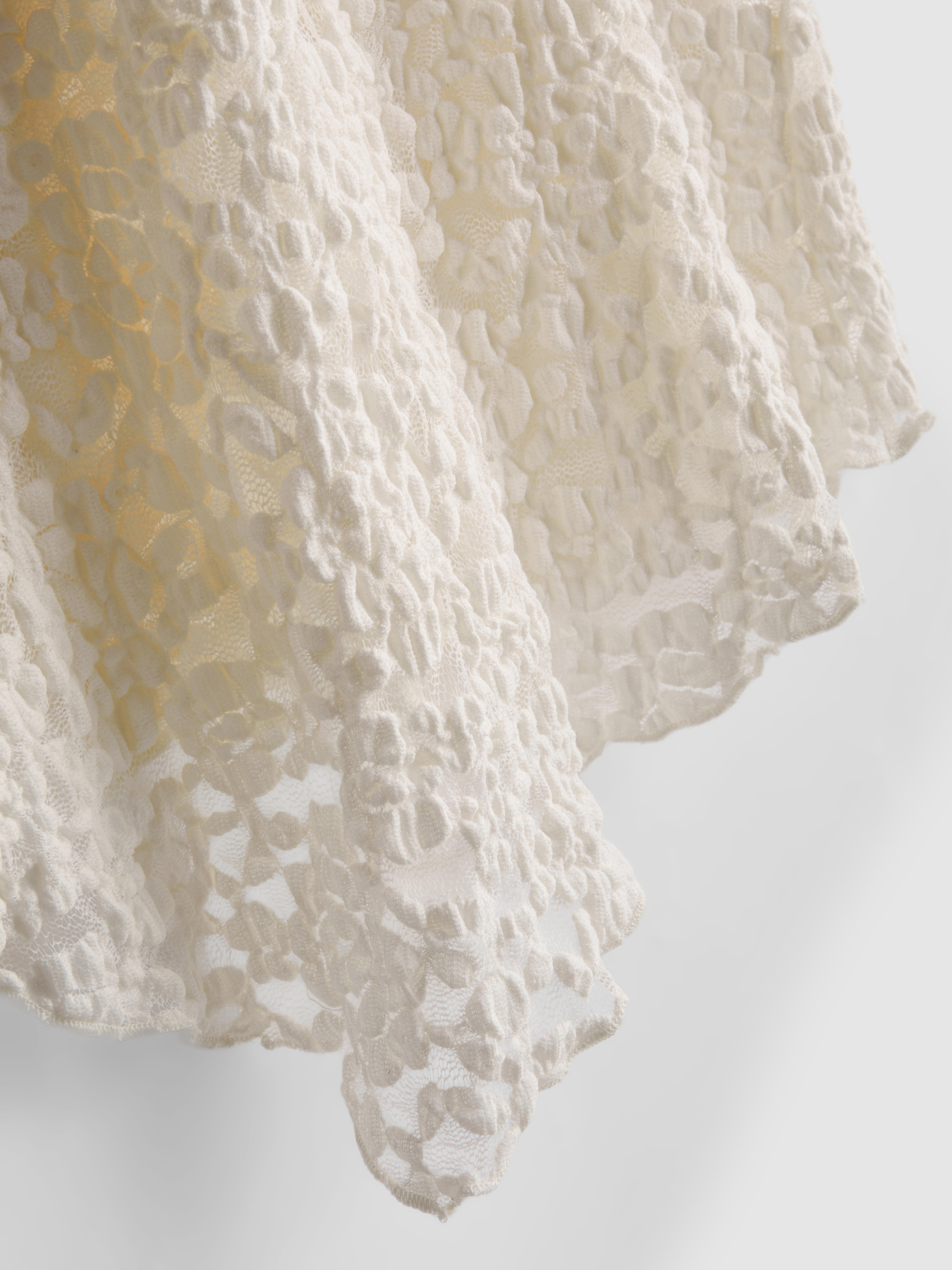 Asymmetrische top van katoenmix met kant en textuur