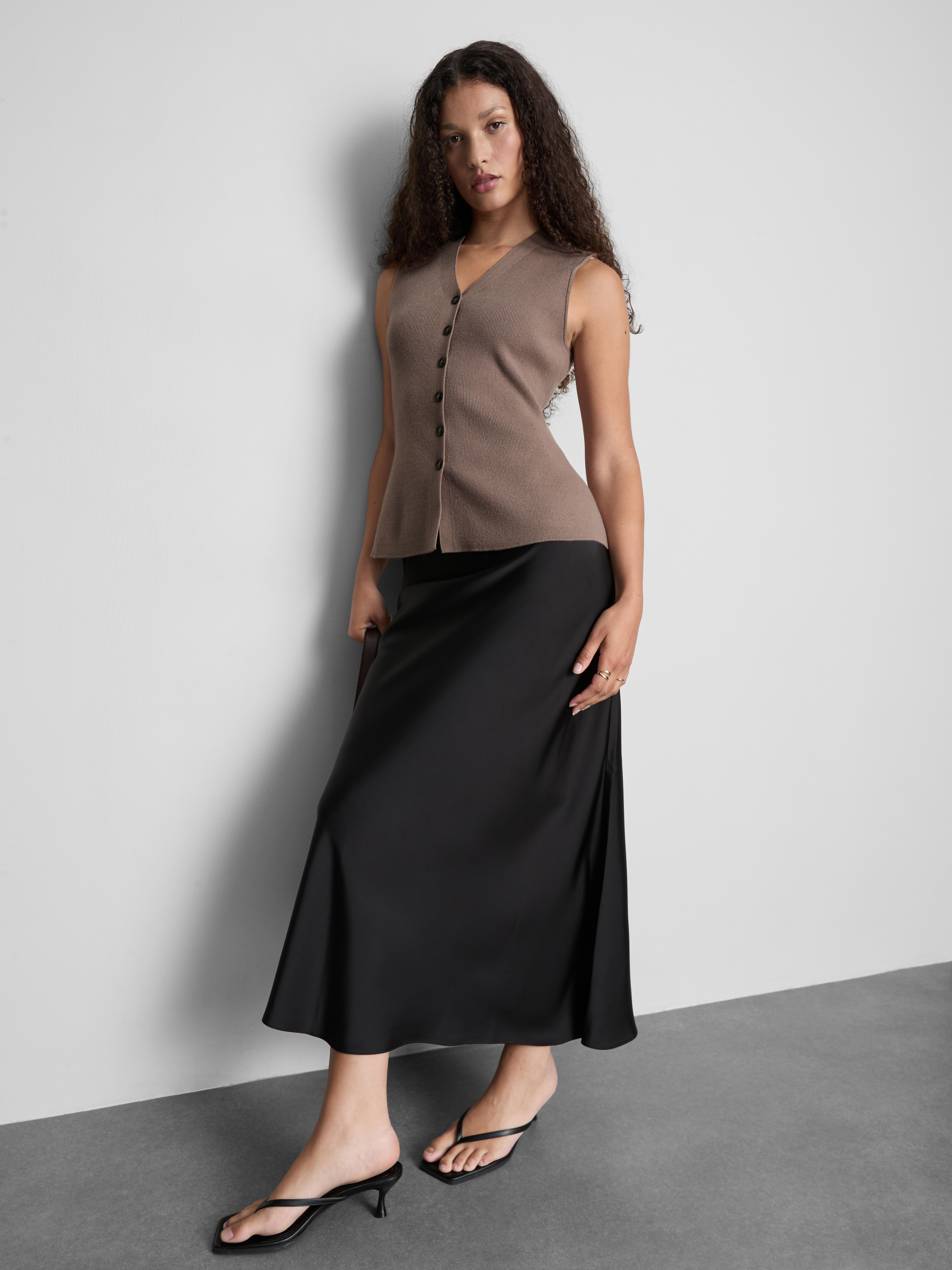 Gebreid mouwloos peplum-gilet The Edit