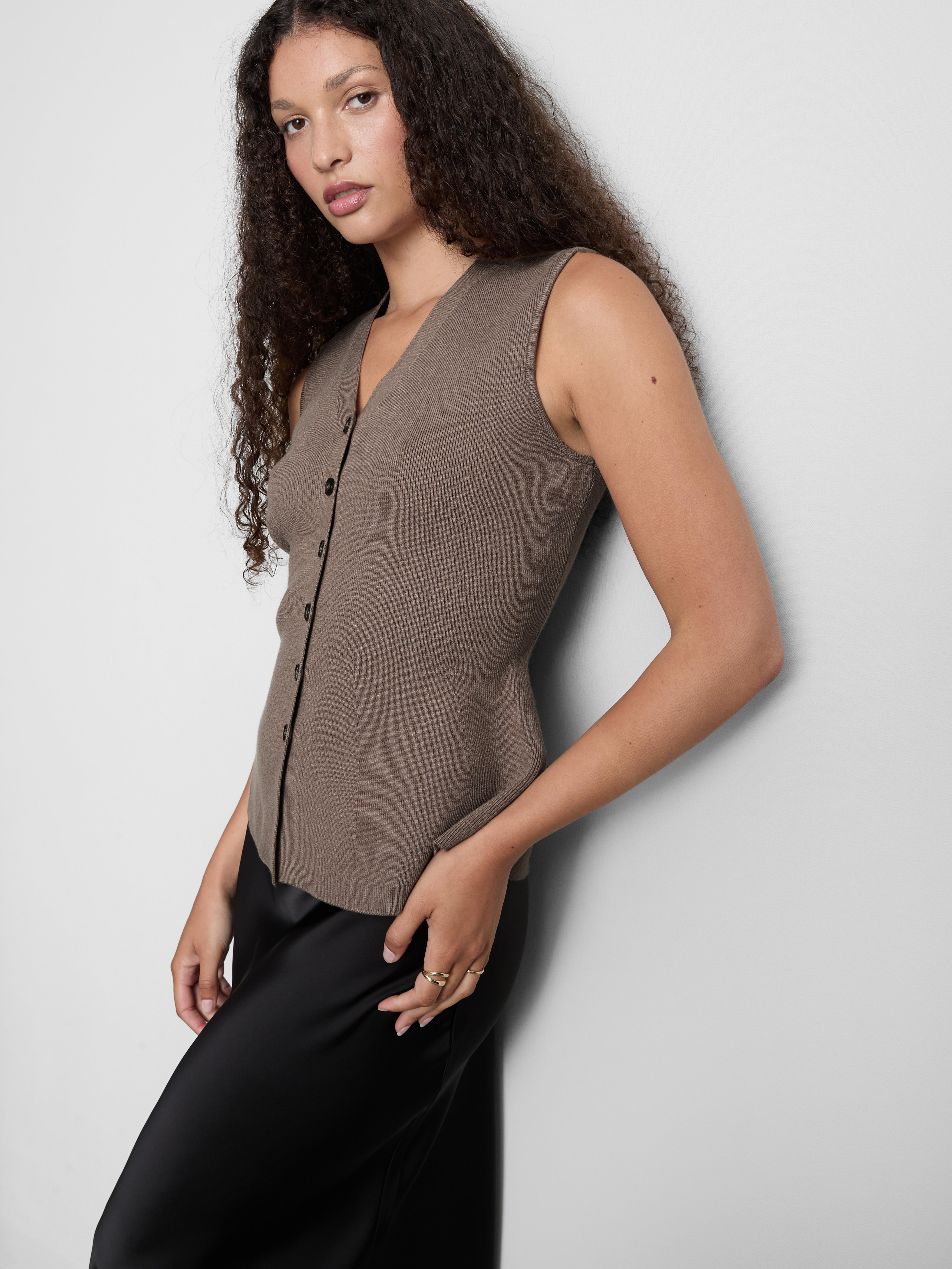 Gebreid mouwloos peplum-gilet The Edit
