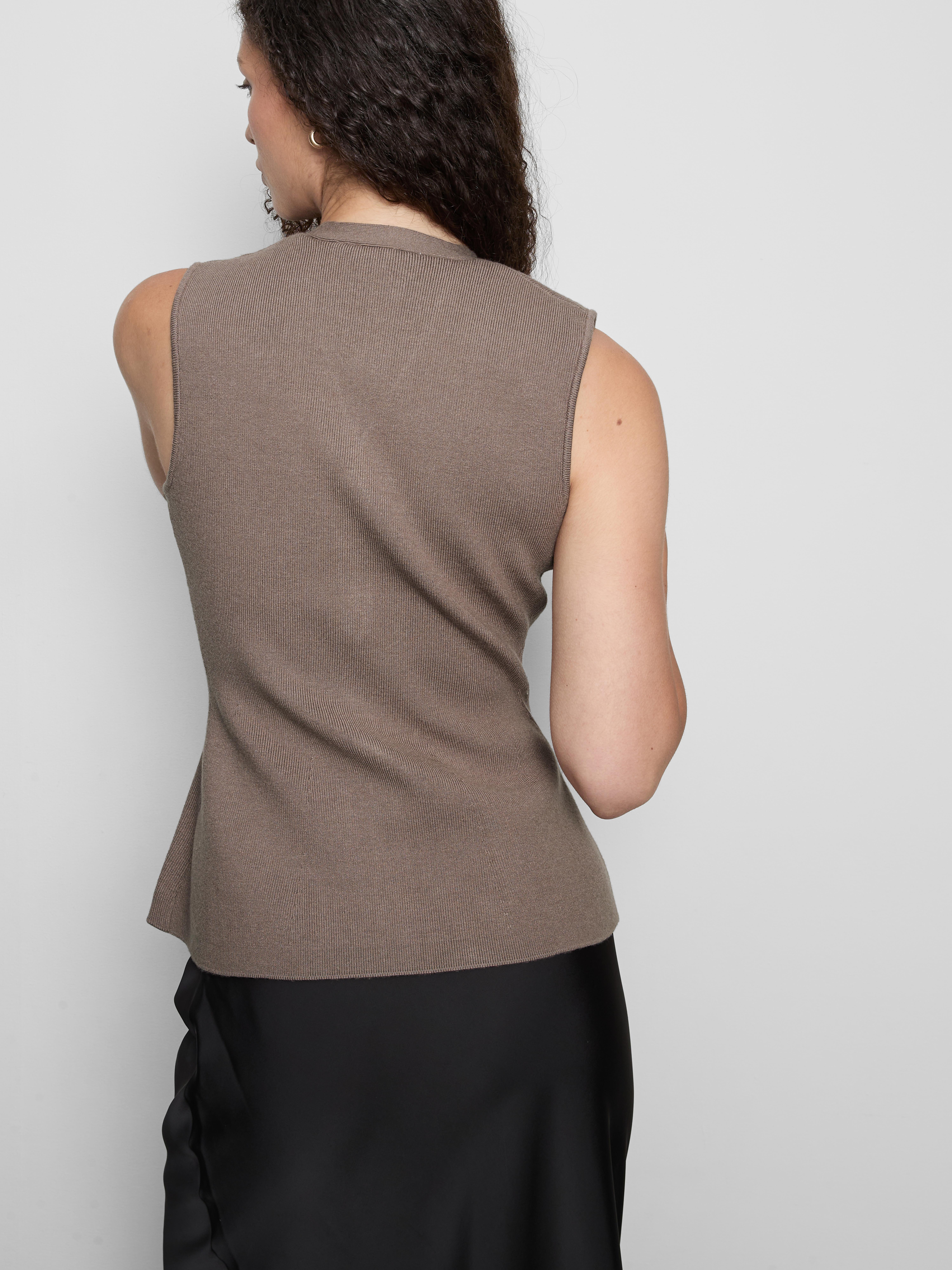 Gebreid mouwloos peplum-gilet The Edit