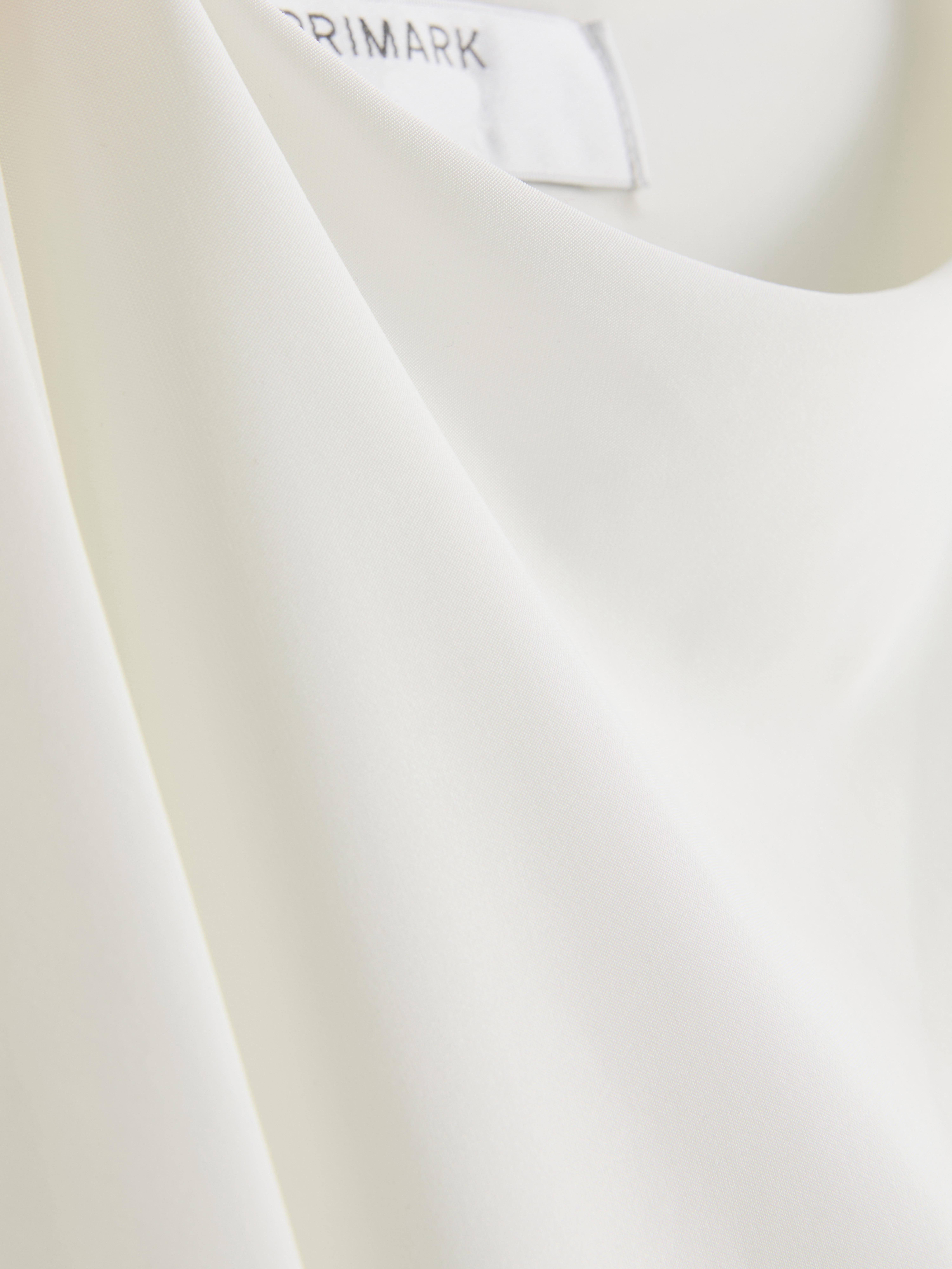 Asymmetric Cape Top