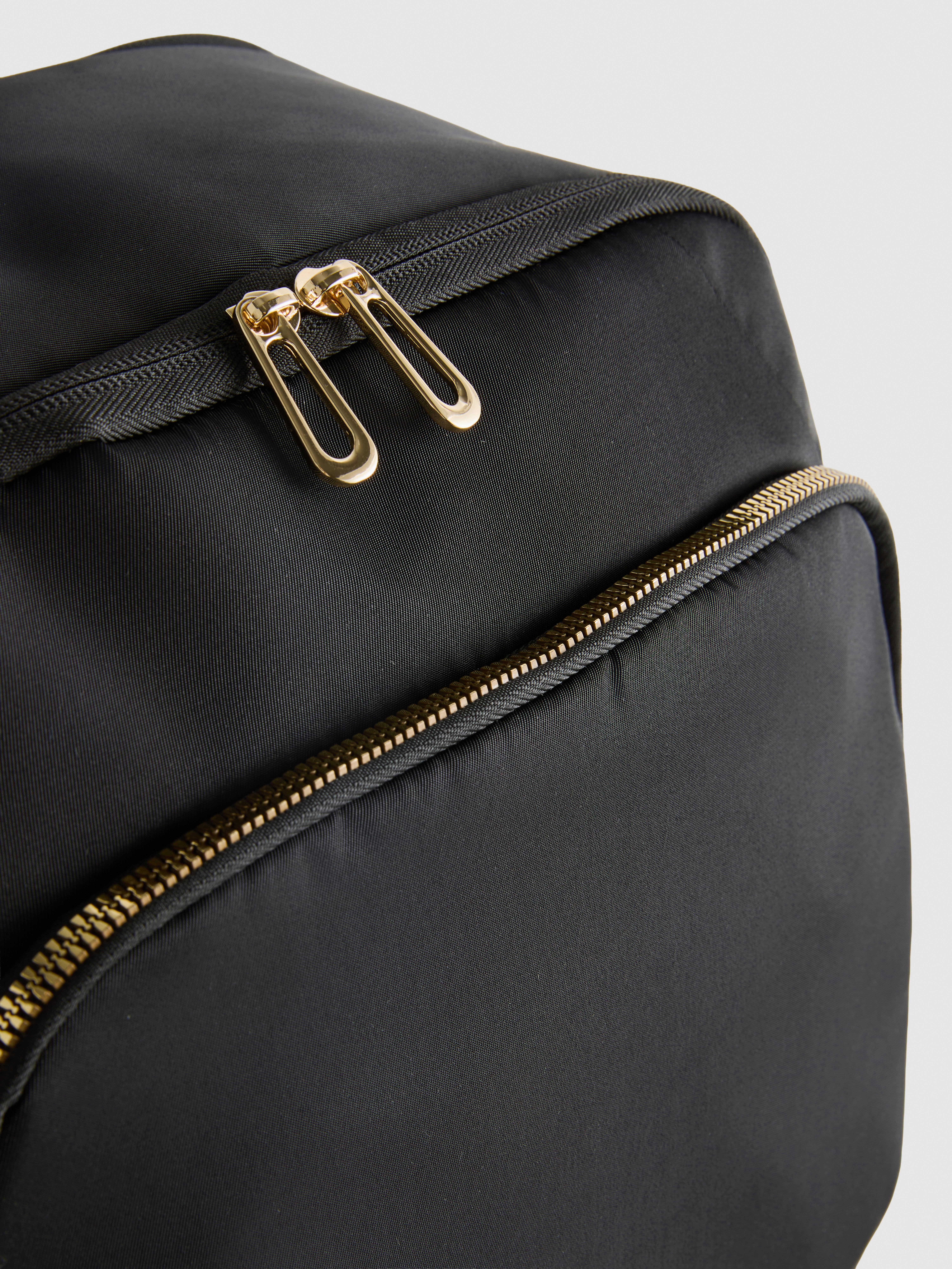 Multi-Zip Backpack
