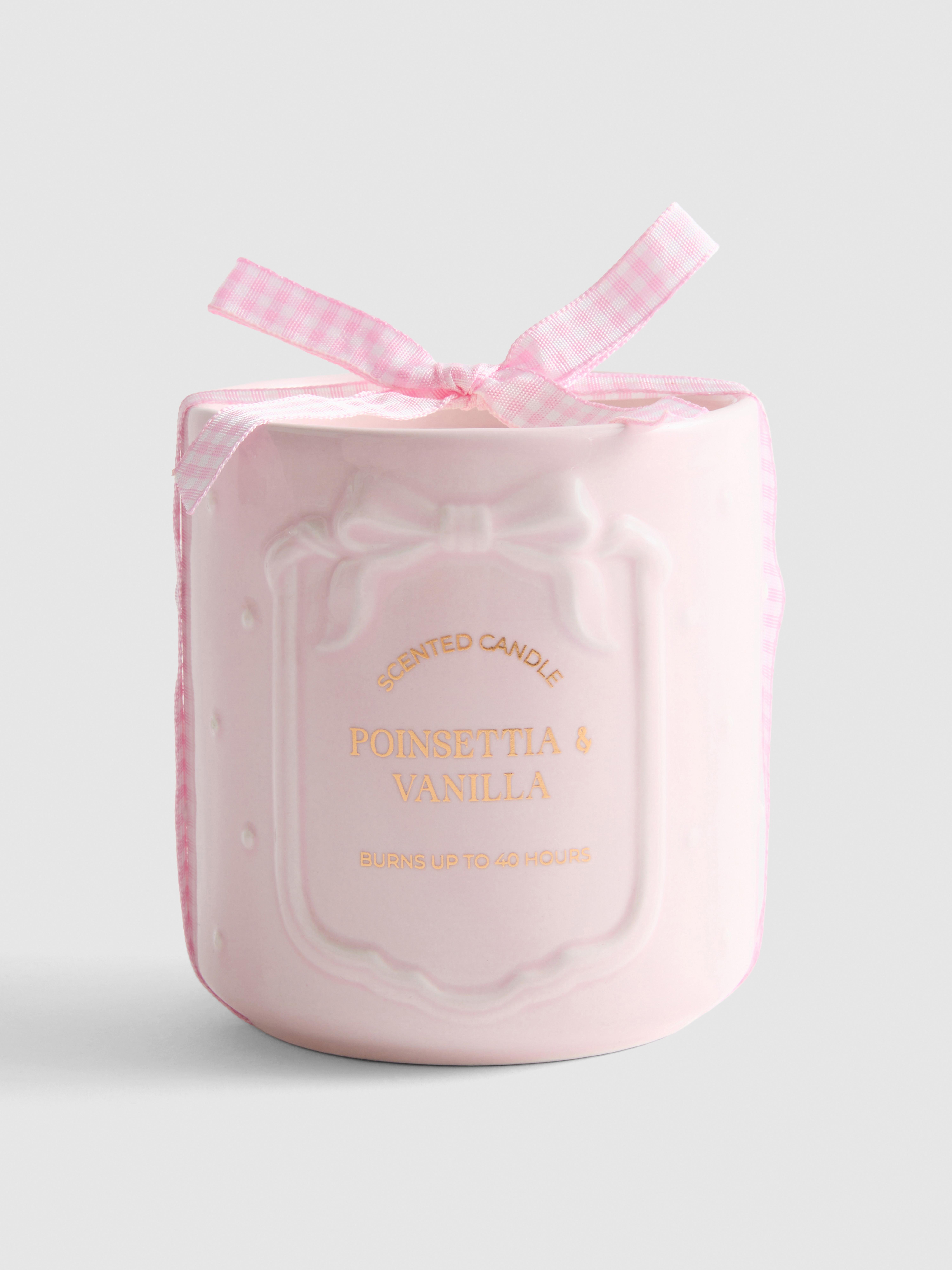 Candela profumata con fiocco in ceramica