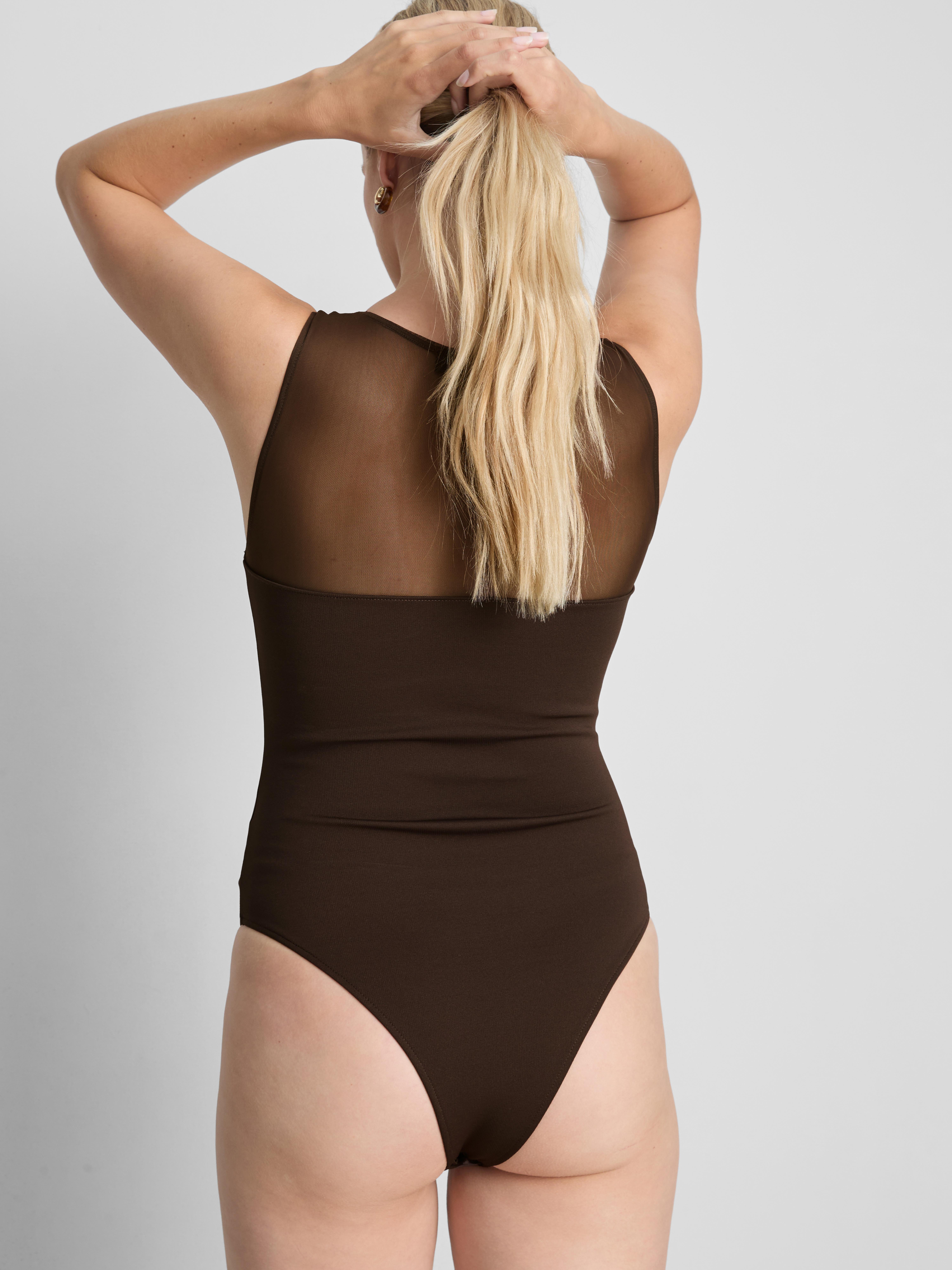 Mouwloze body met mesh inzetstuk