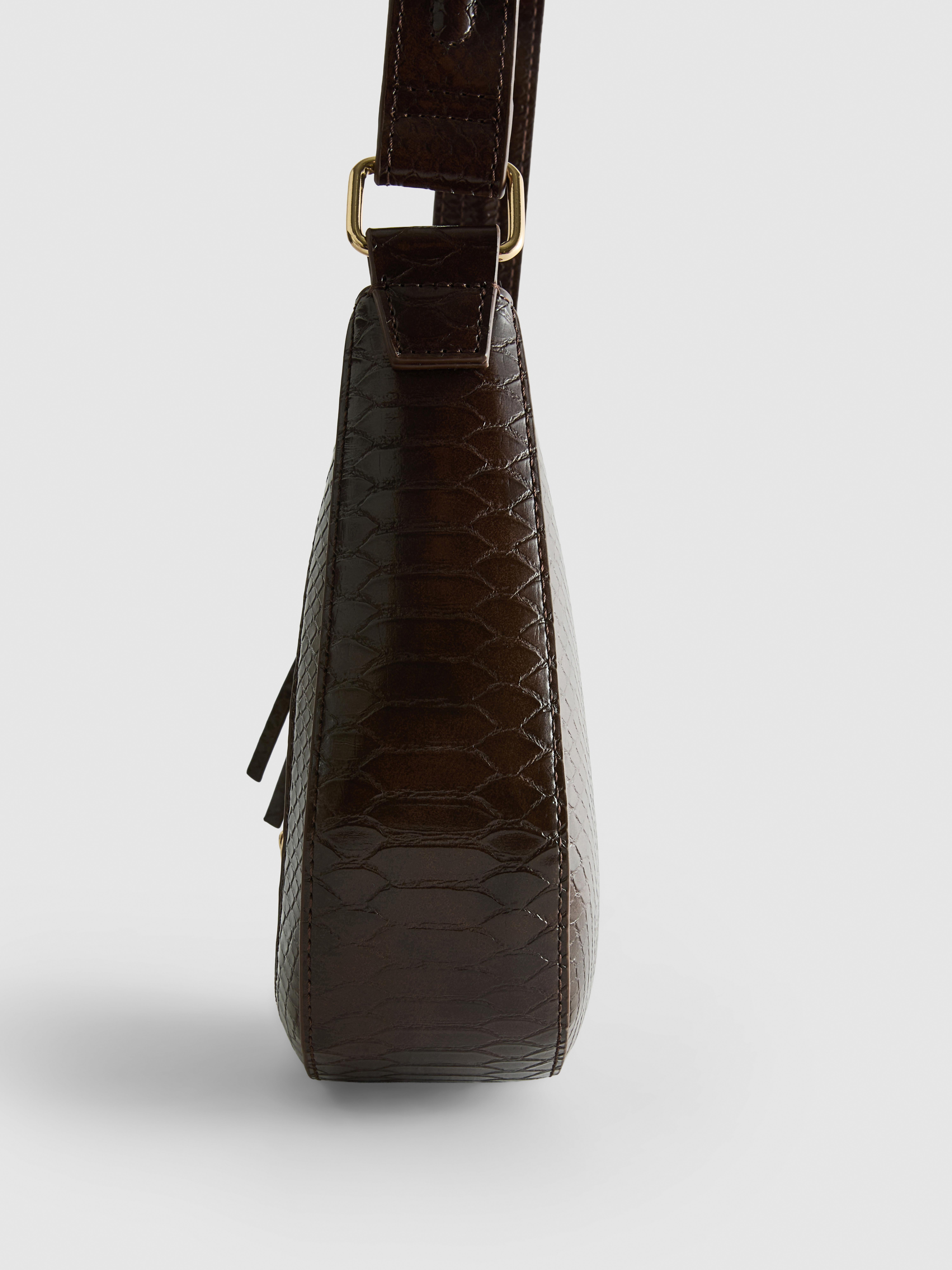 Sac bandoulière en simili cuir à mors
