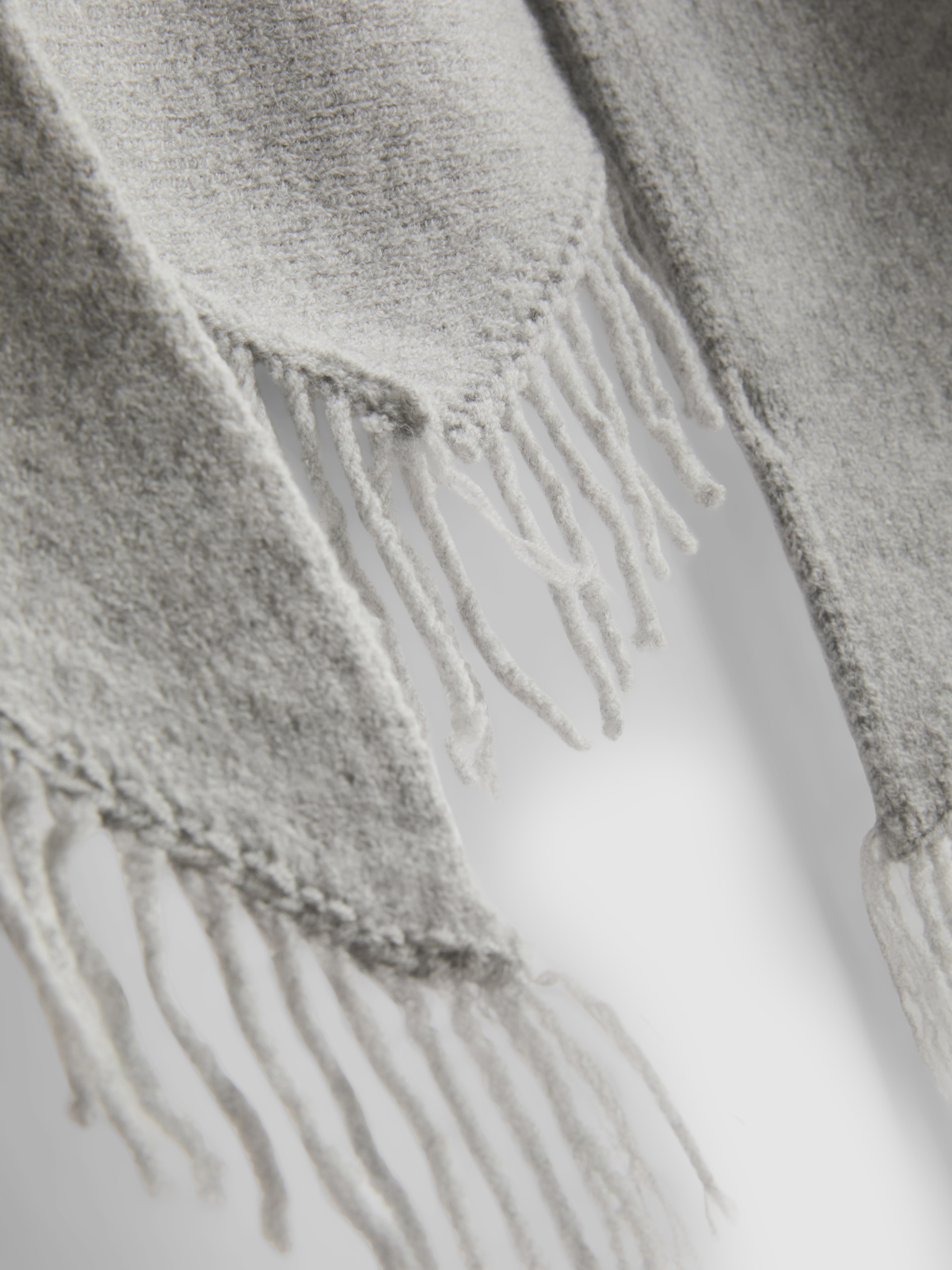 Paula Echevarría Fringed Ruana Scarf