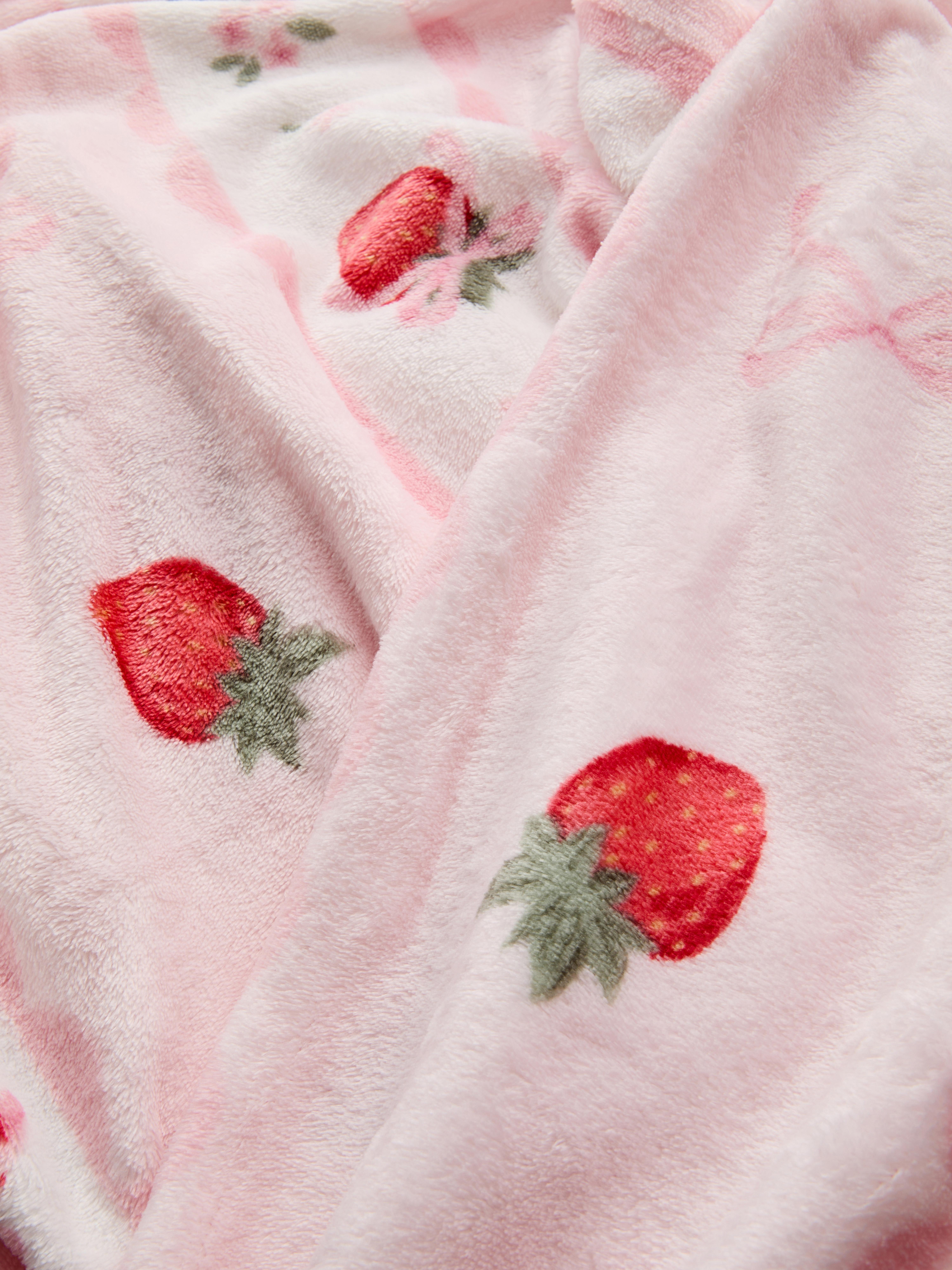 Coperta con fiocchi e fragole