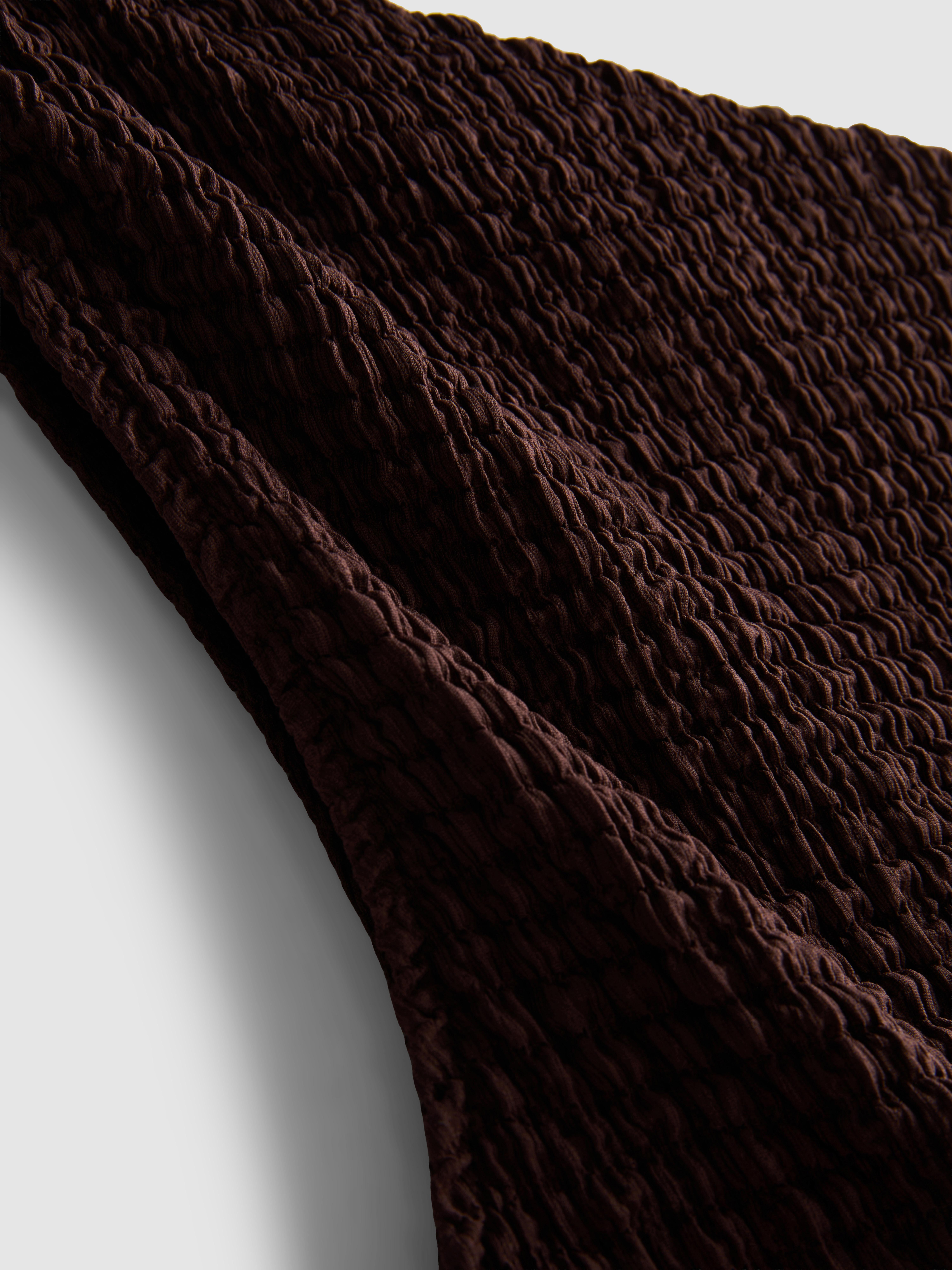 Asymmetrische top met kanten rand en textuur