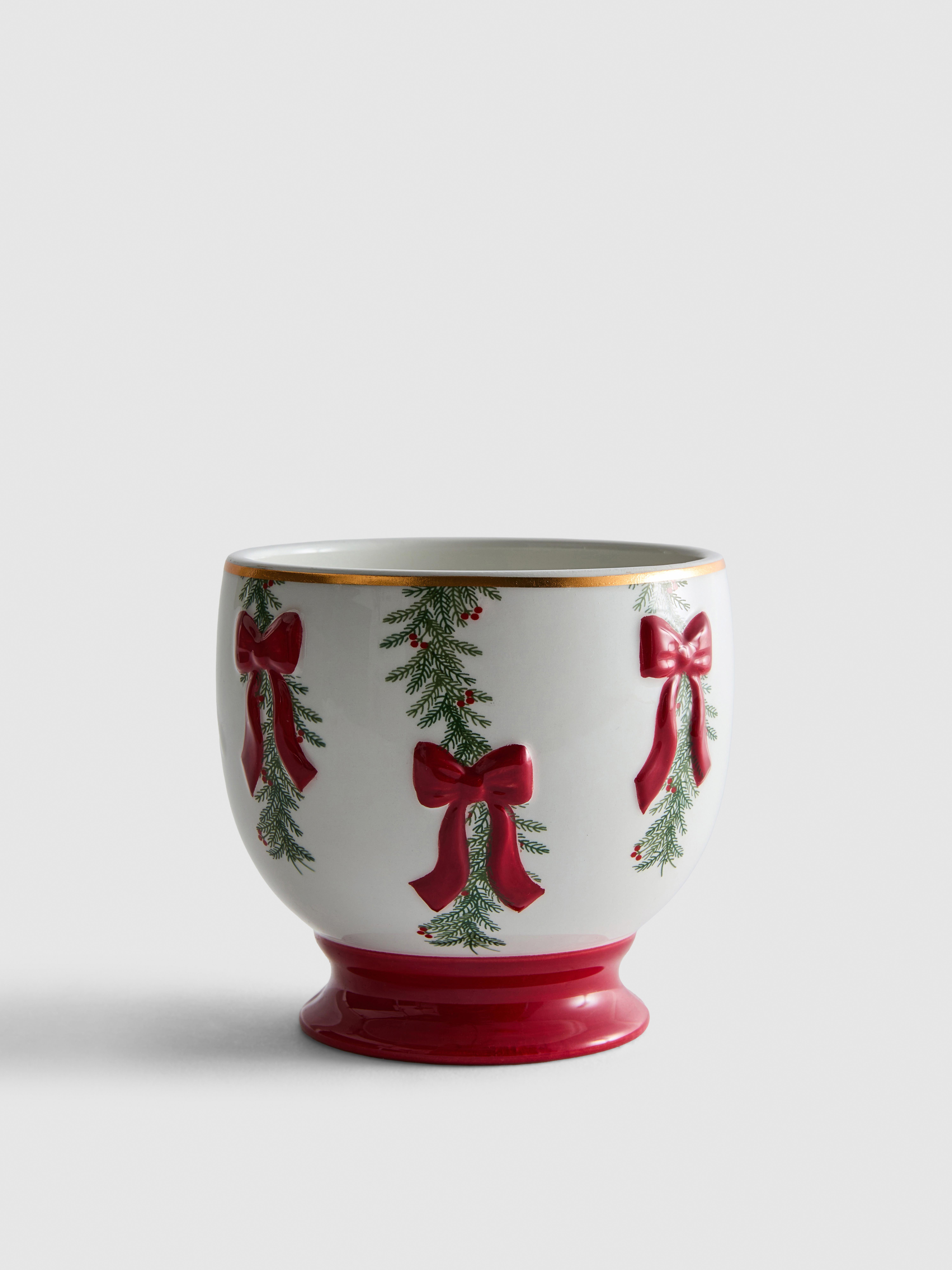 Vaso per piante in ceramica con ghirlanda e fiocchi