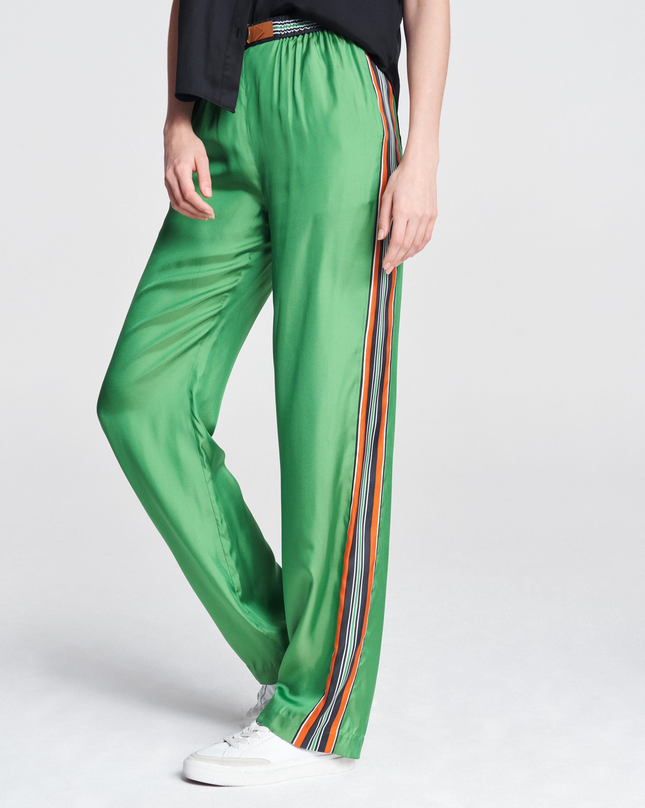 Tracksuit trousers for men and women in asparagus green cotton blend.