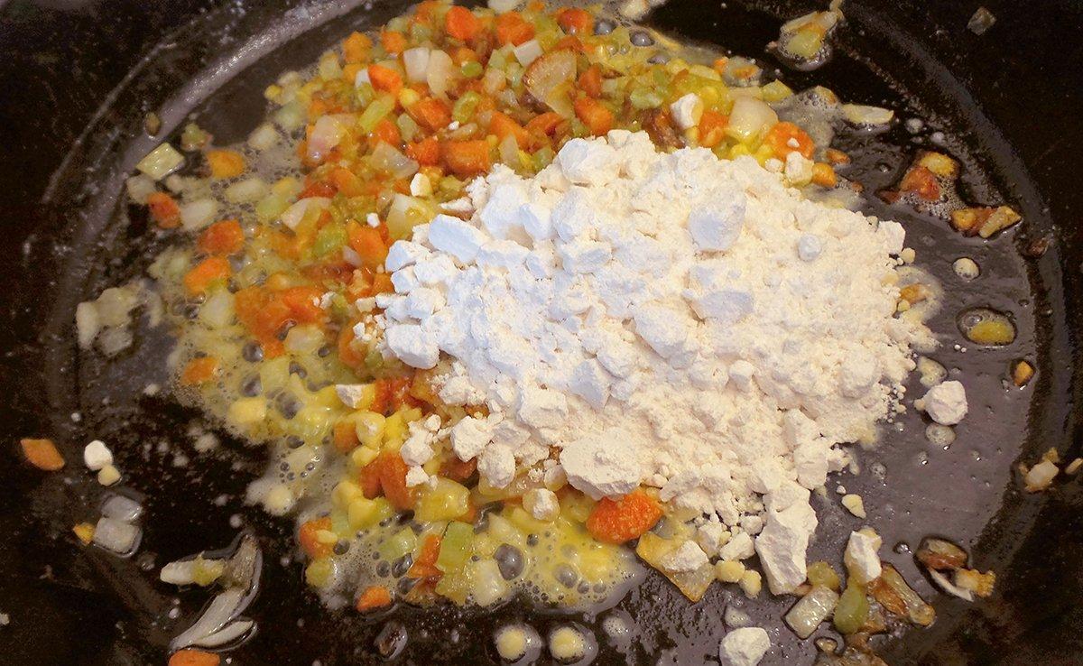 Add flour to the vegetables and stir till their are no lumps and the flour has started to brown a bit.
