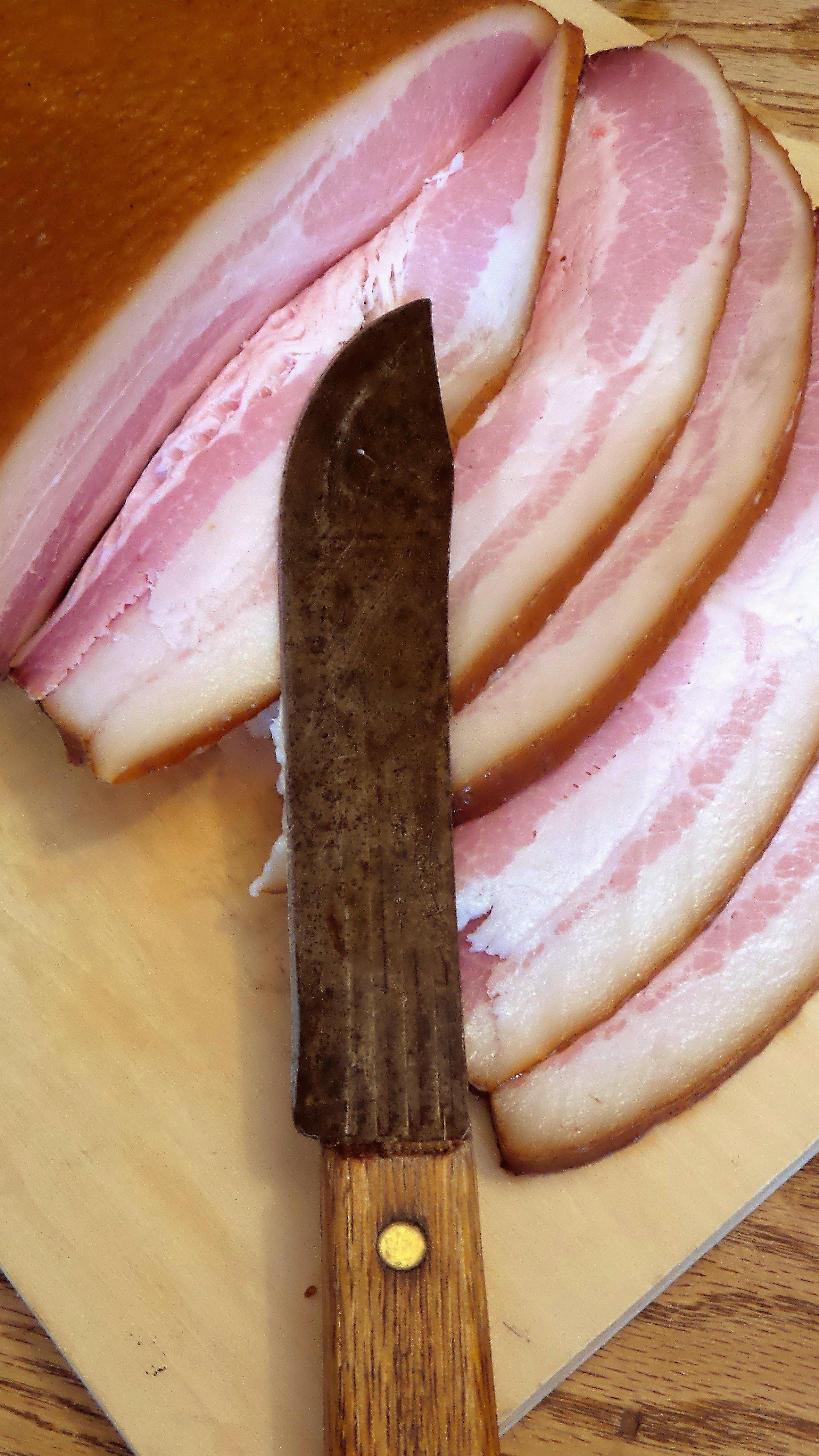 You can slice the bacon by hand with a sharp knife.