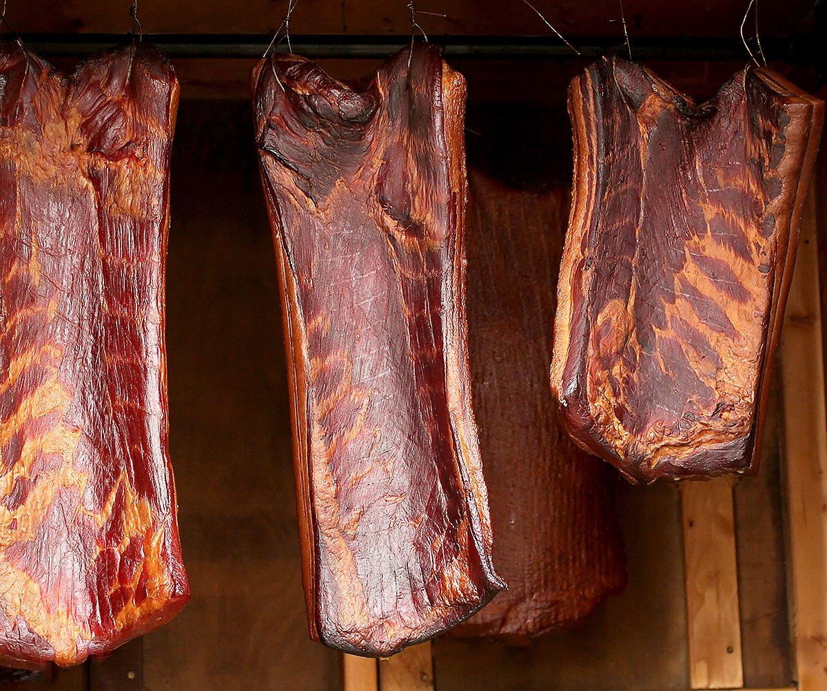 The longer the bacon smokes, the deeper its color and flavor will become.