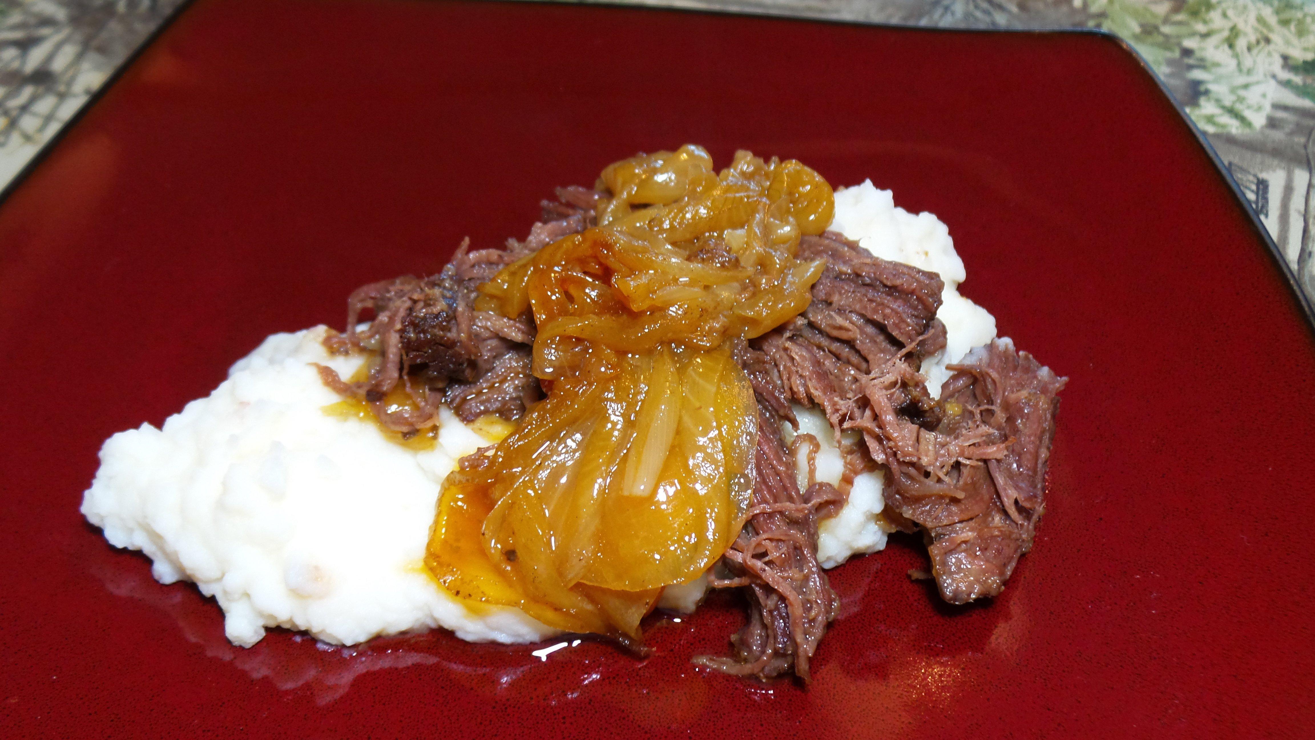 Beer braised elk chuck roast and onions served over mashed potatoes.