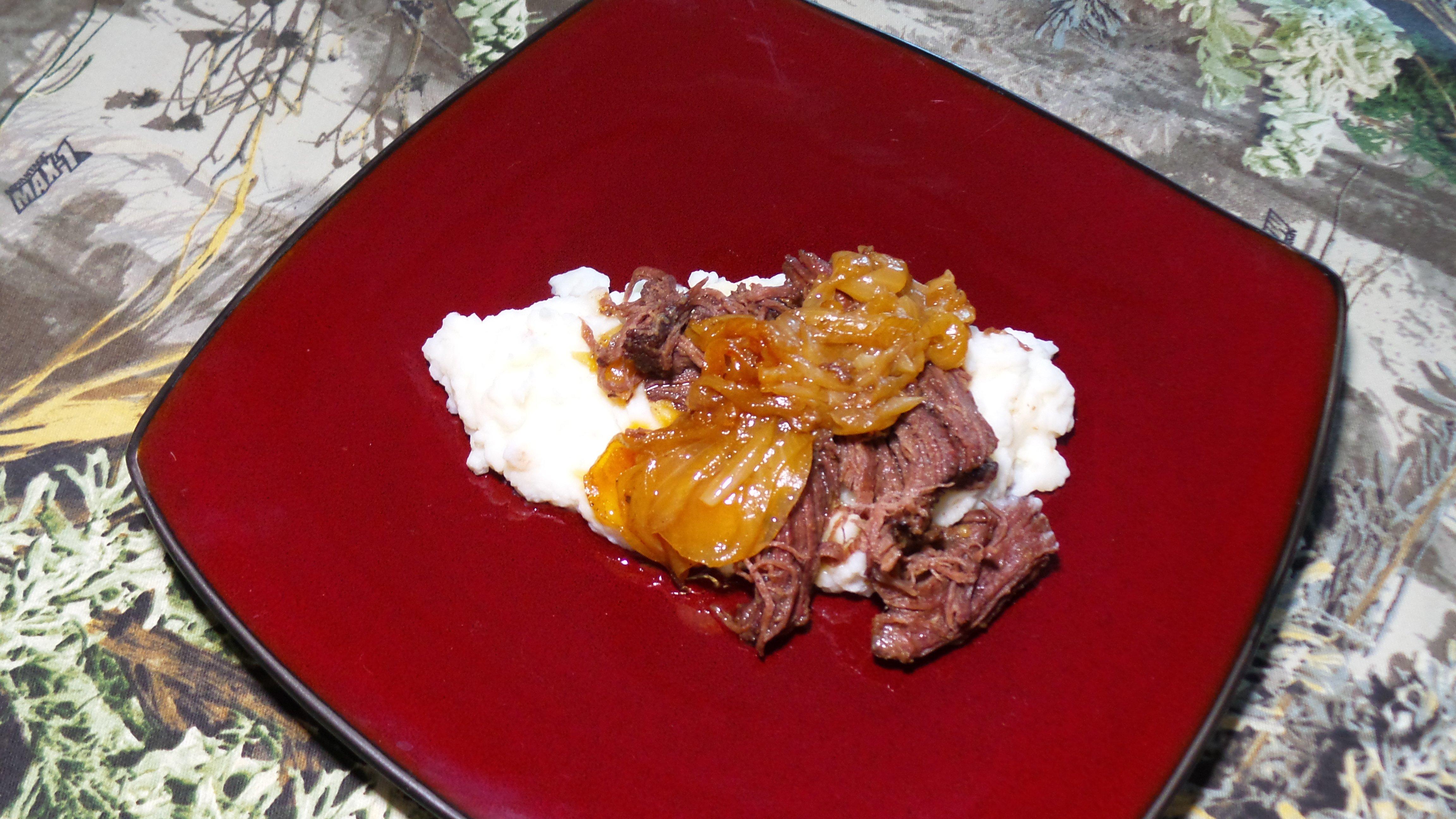 Beer braised elk and onions over mashed potatoes.