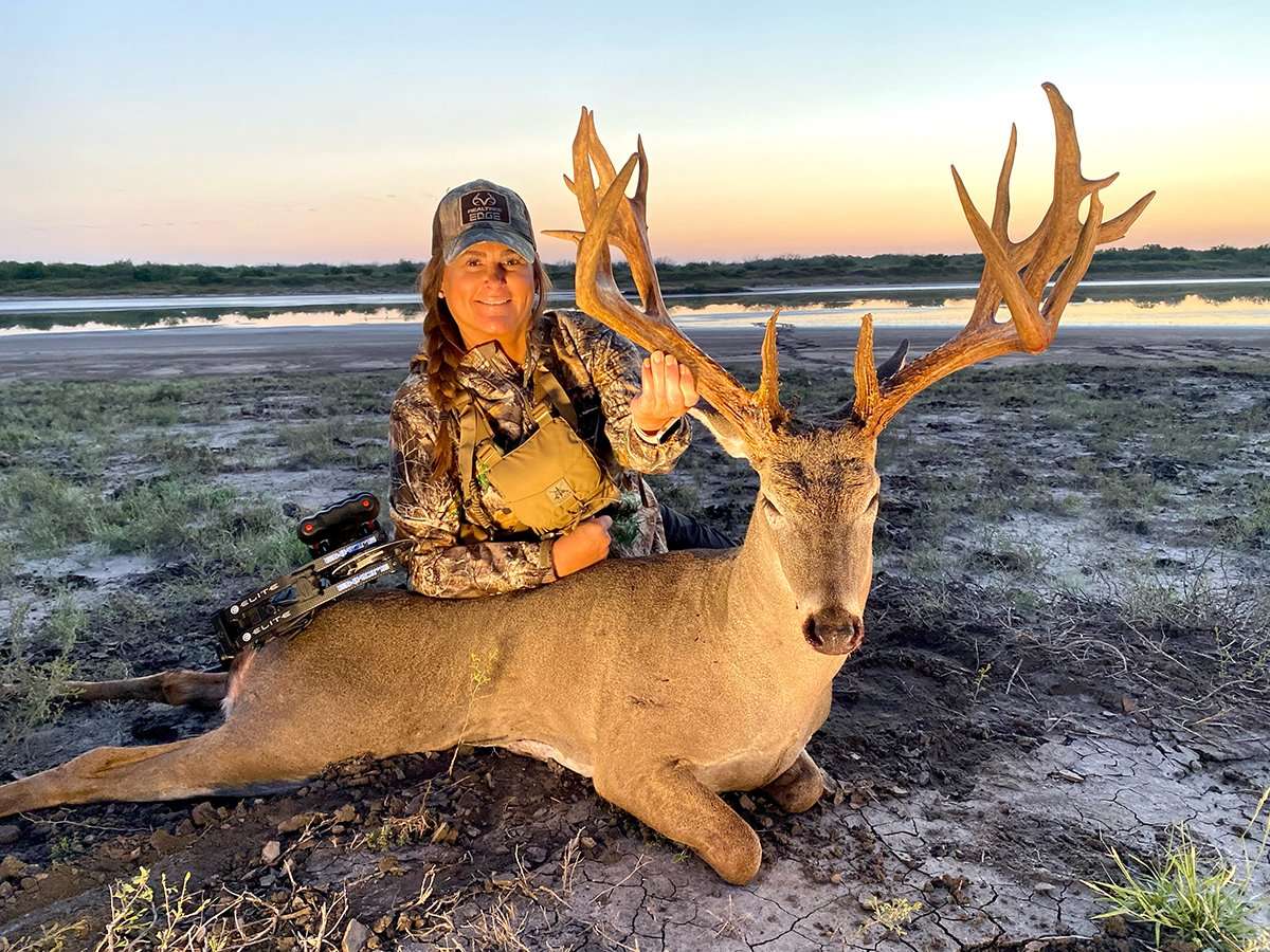 Bonnie McFerrin is all smiles with her monster Texas buck. Image by Legends of the Fall