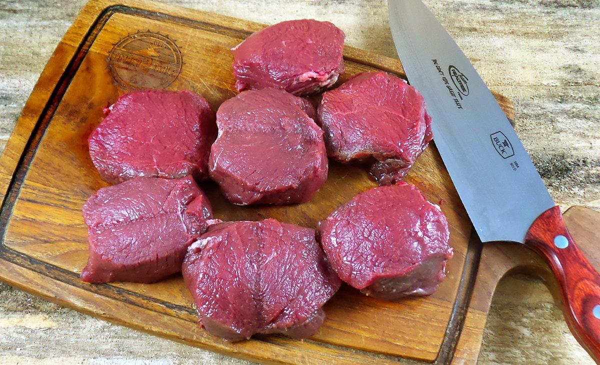 Slice the backstrap into inch thick medallions.