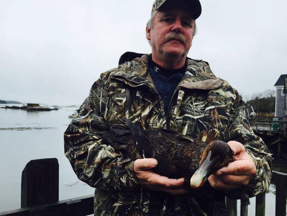Brad Allen, Maine Department of Inland Fisheries and Wildlife's Bird Project Leader with a Maine sea duck. (Courtesy Federal Premium)