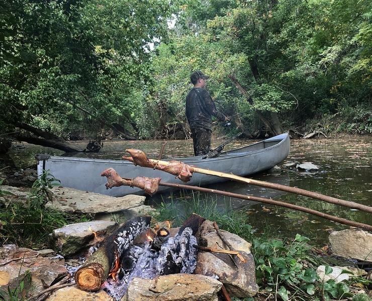 Potroast gets in a bit of fishing time while our squirrels slowly roast over the fire.