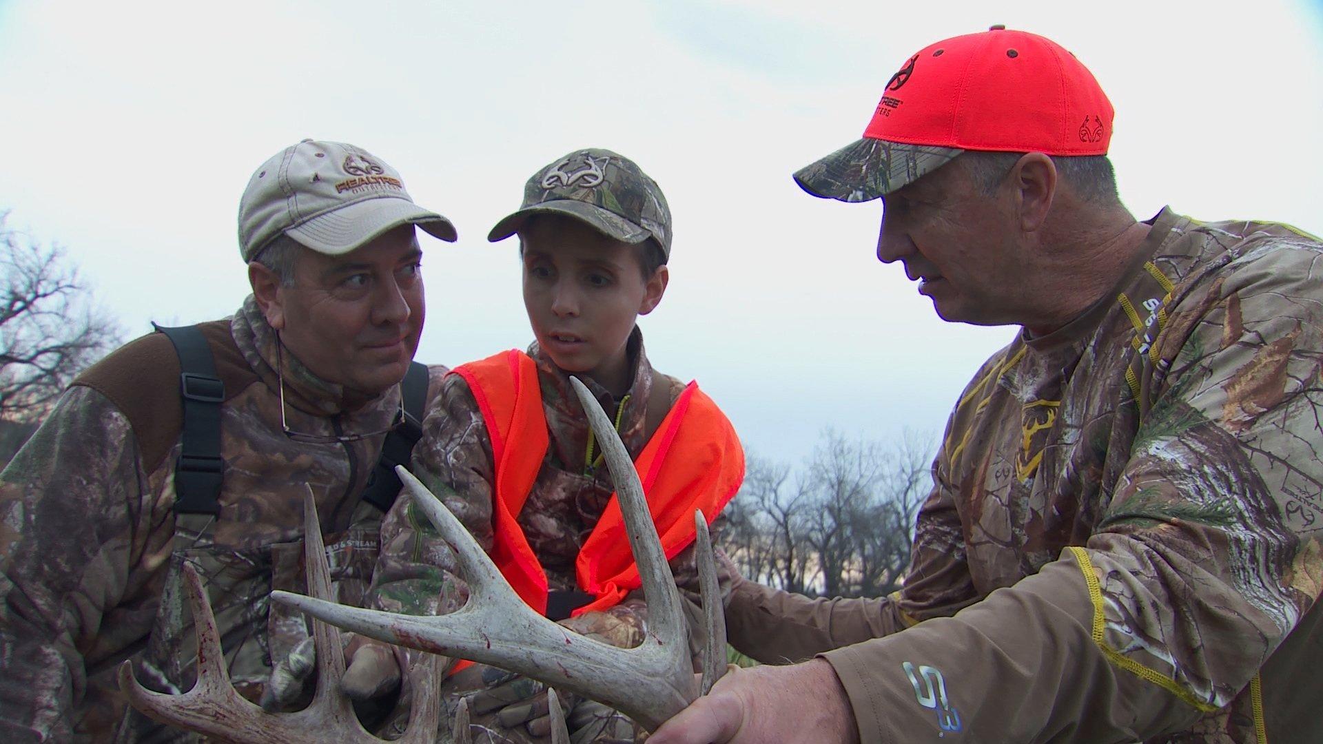 Chip Madren, his father, and David Blanton admire his Montana 10-pointer.