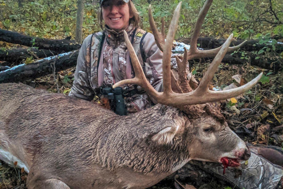 Christina Krajcsovics tags a buck of a lifetime on a journey away from home. (RJ Krajcsovics photo)