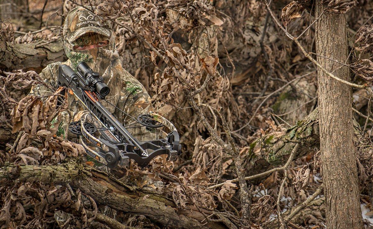 Makeshift blinds work well for crossbow hunting. Just be sure the bow riser is clear of limbs before shooting. (Bill Konway Image)