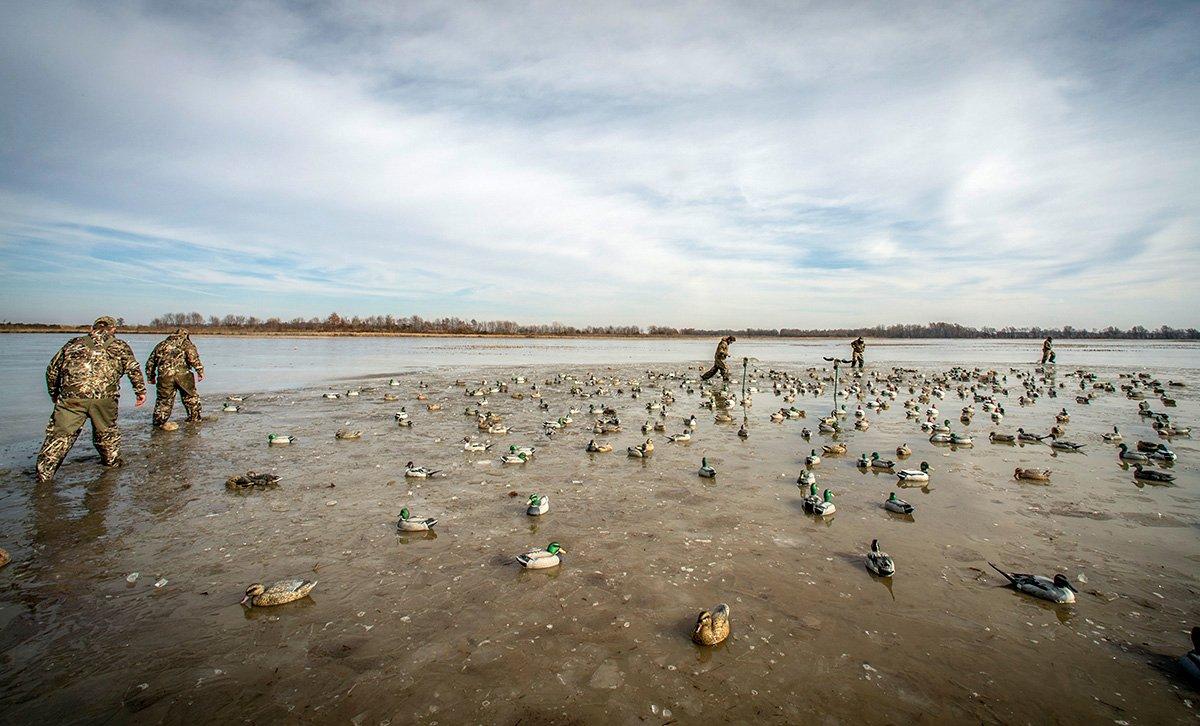 Breaking ice to set 150 decoys before dawn? That's normal behavior for someone afflicted with ODH disorder. Photo © Bill Konway